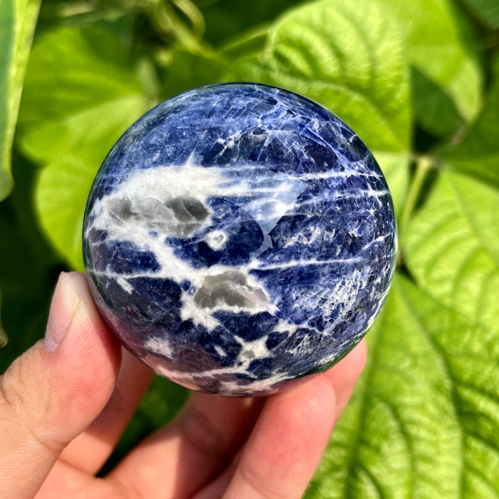 Blue sodalite orb with calming energy and metaphysical properties