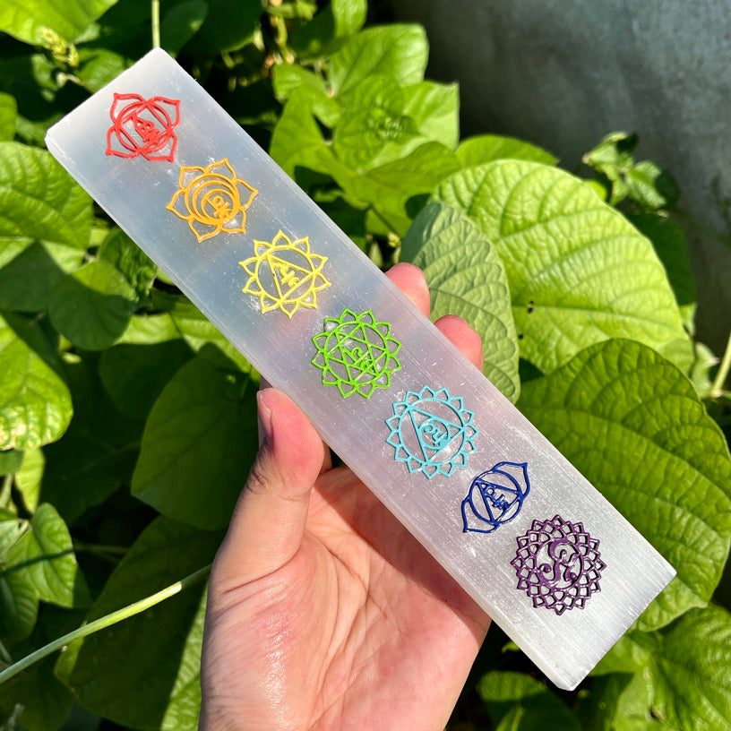 Chakra healing selenite stick featuring rainbow energy centers