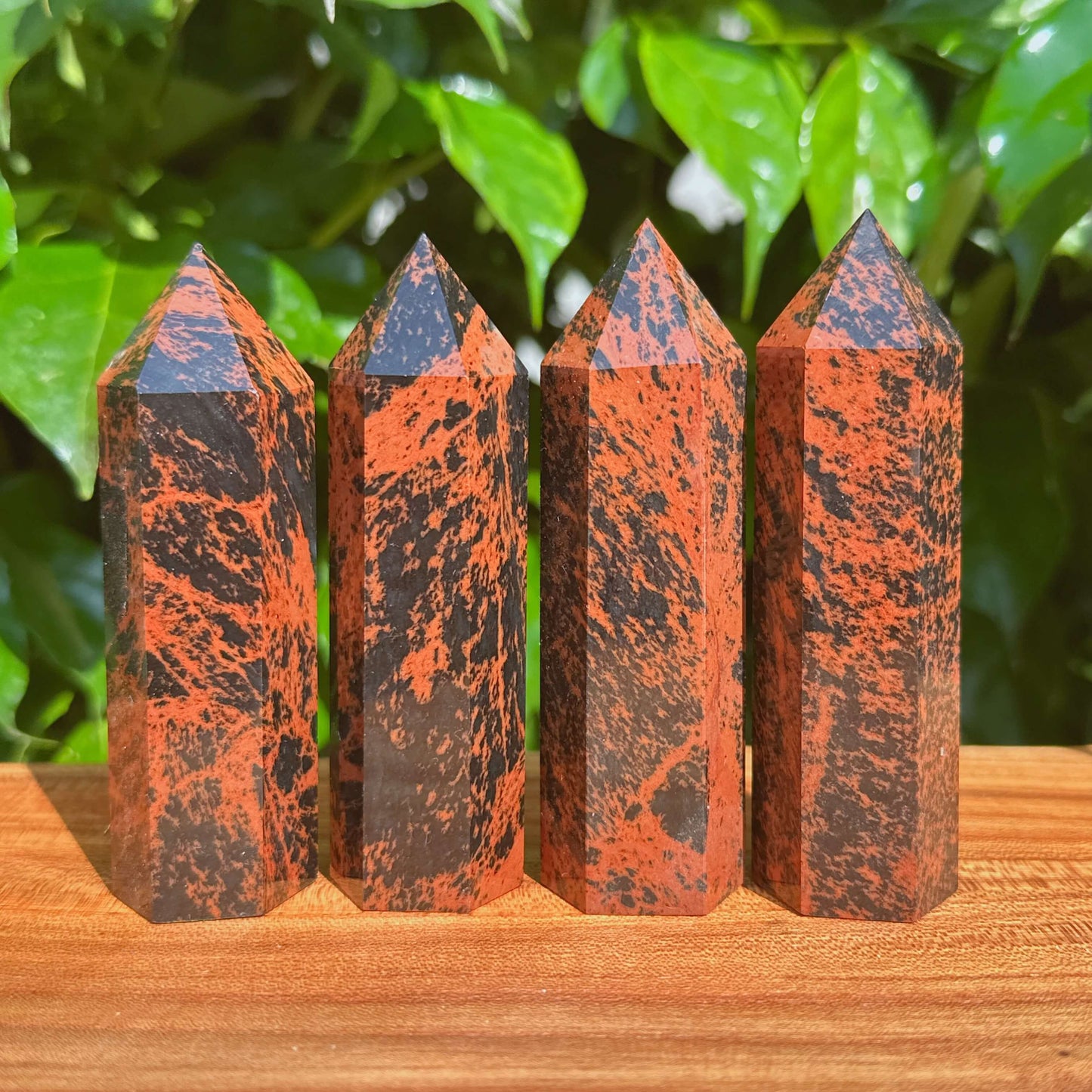 Mahogany Obsidian Tower with distinctive black and reddish patterns, perfect for crystal healing and decor.