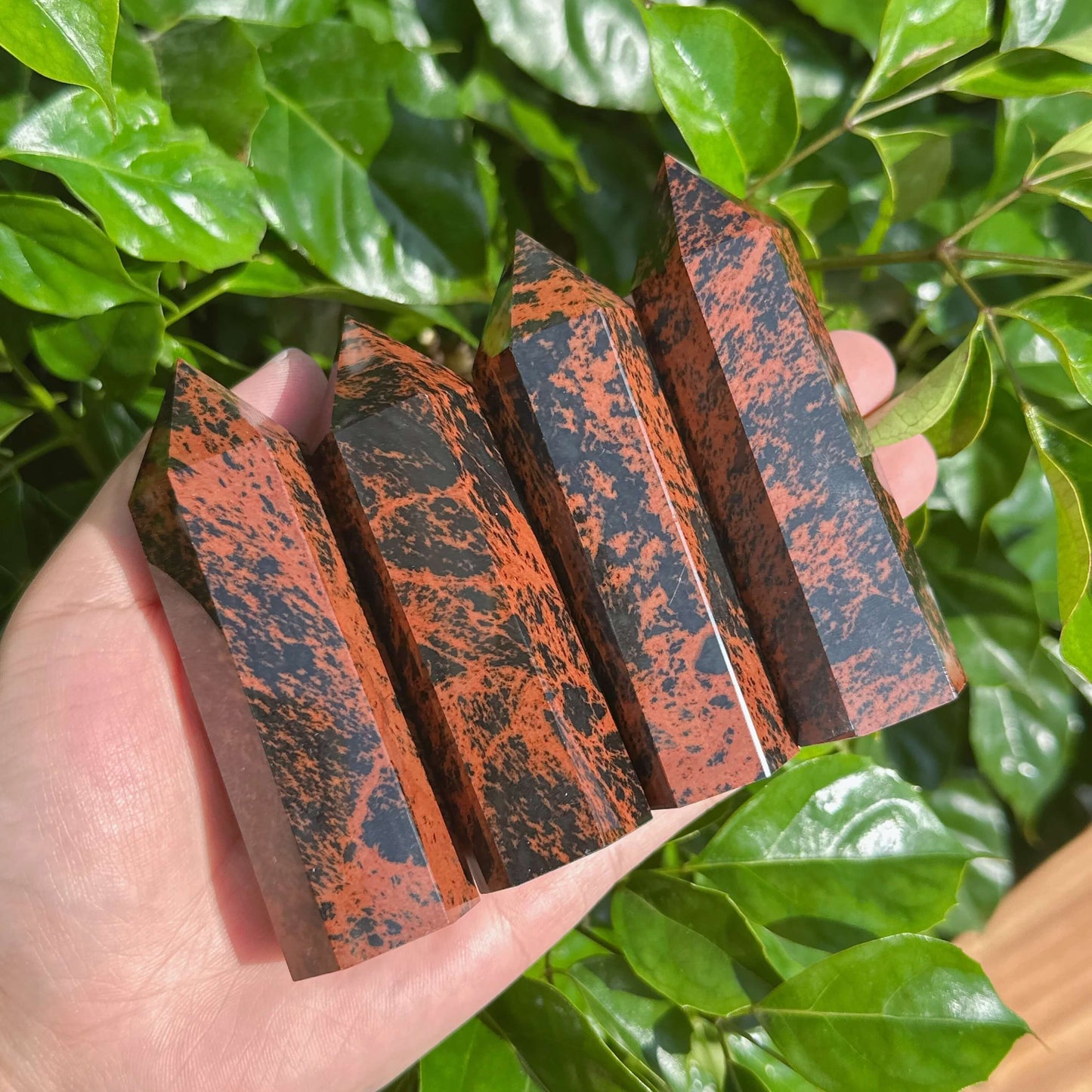 Set of Mahogany Obsidian Towers showcasing deep red and black color variations, ideal for energy work and home accents.