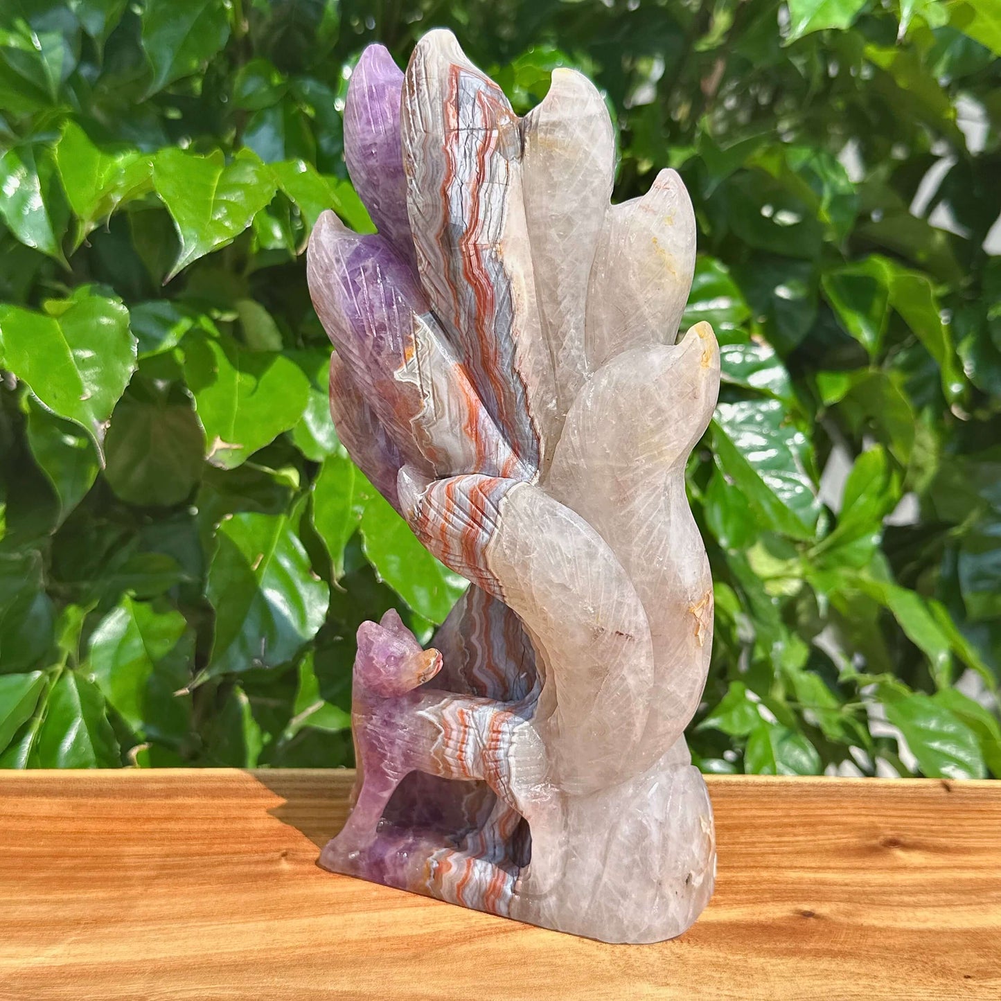 Amethyst Agate Nine-Tailed Fox Carving on display, capturing the fine craftsmanship of the sculpture.