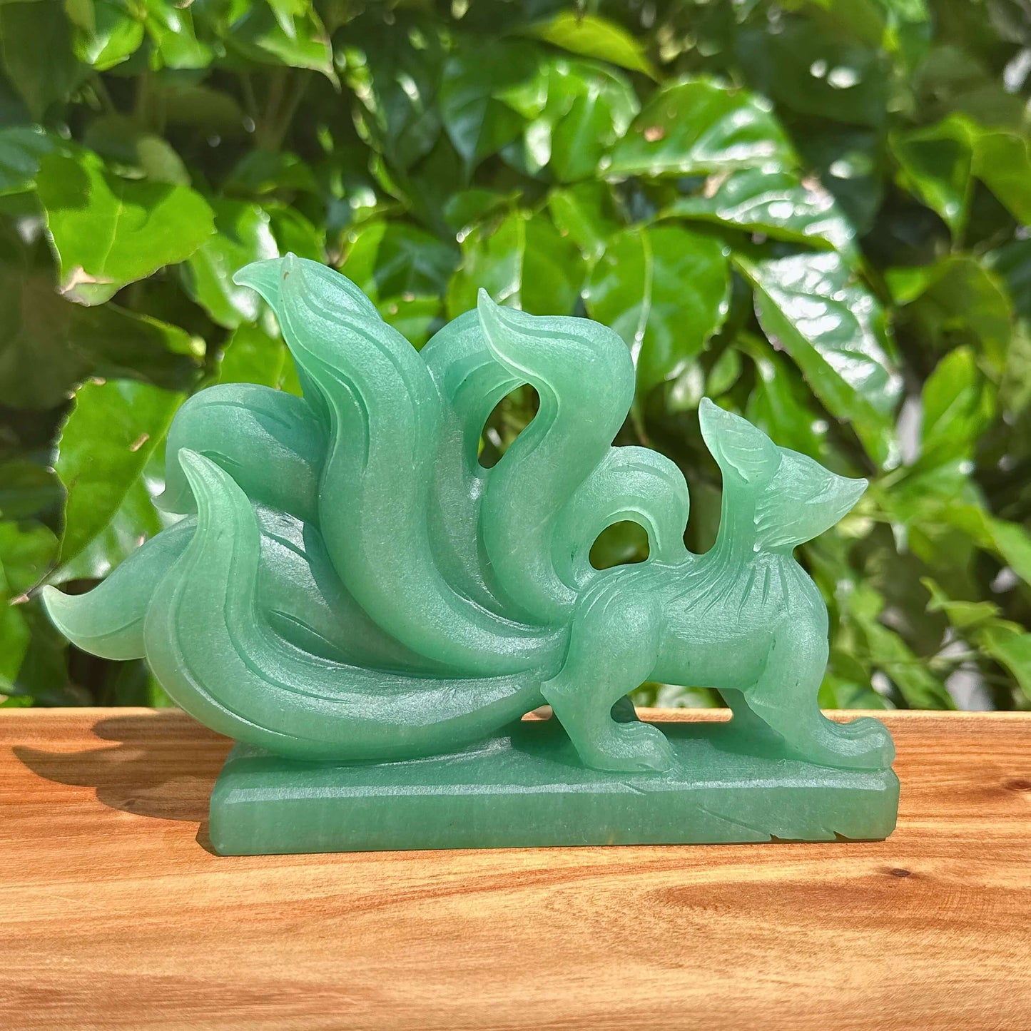 Green Strawberry Quartz Nine-Tailed Fox Carving showcasing intricate details and vibrant green hues.