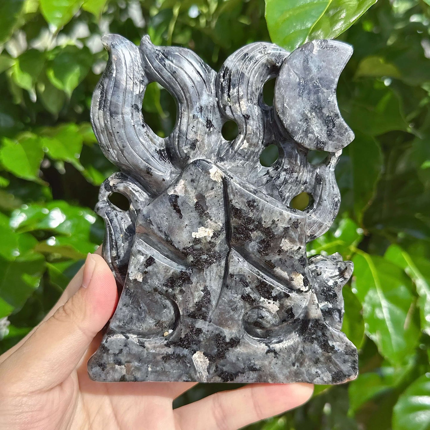 Close-up of the Larvikaite Nine-Tailed Fox Carving with a focus on its fine texture and stone patterns.