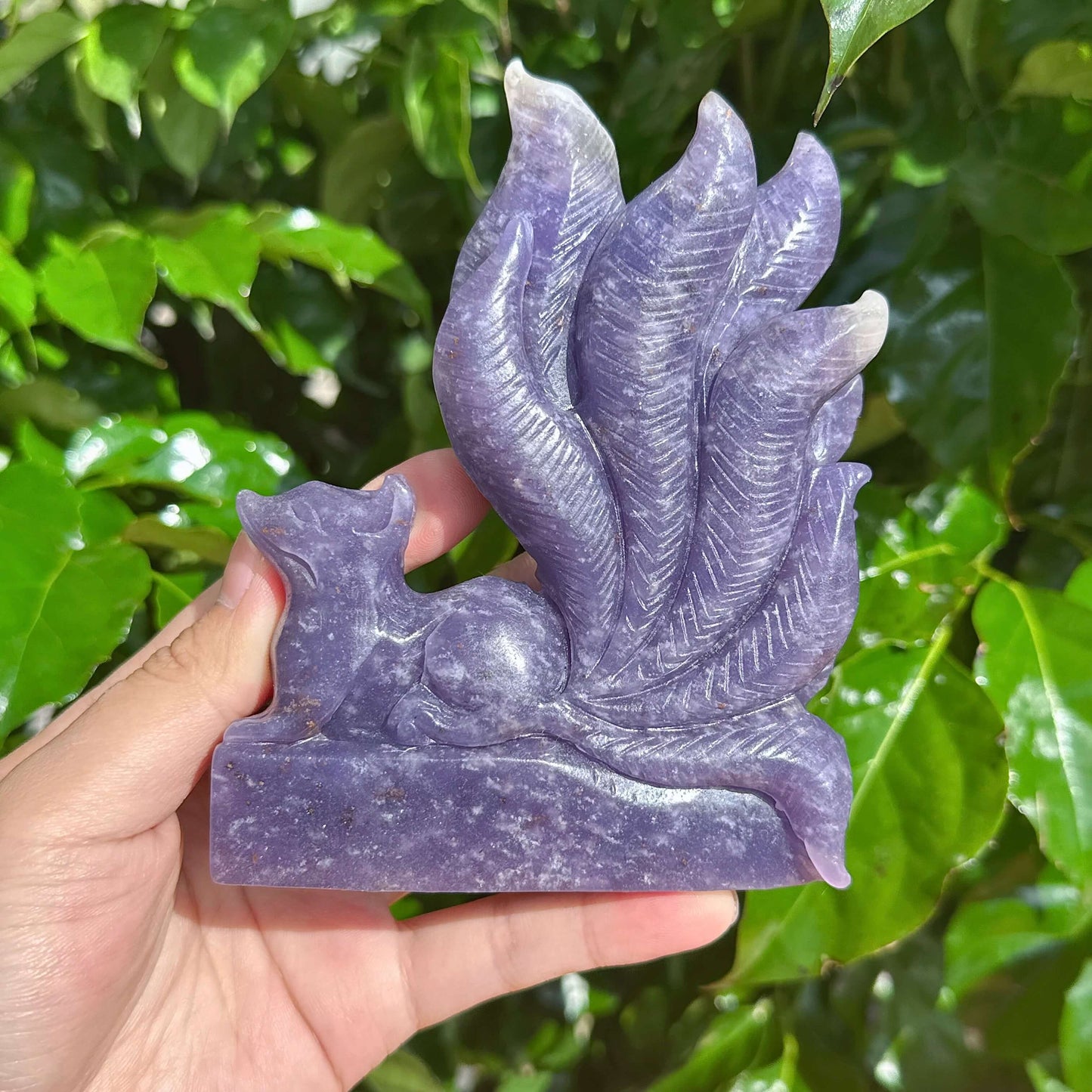 Detailed Lepidolite Nine-Tailed Fox sculpture showing the intricate tail and crystal texture.