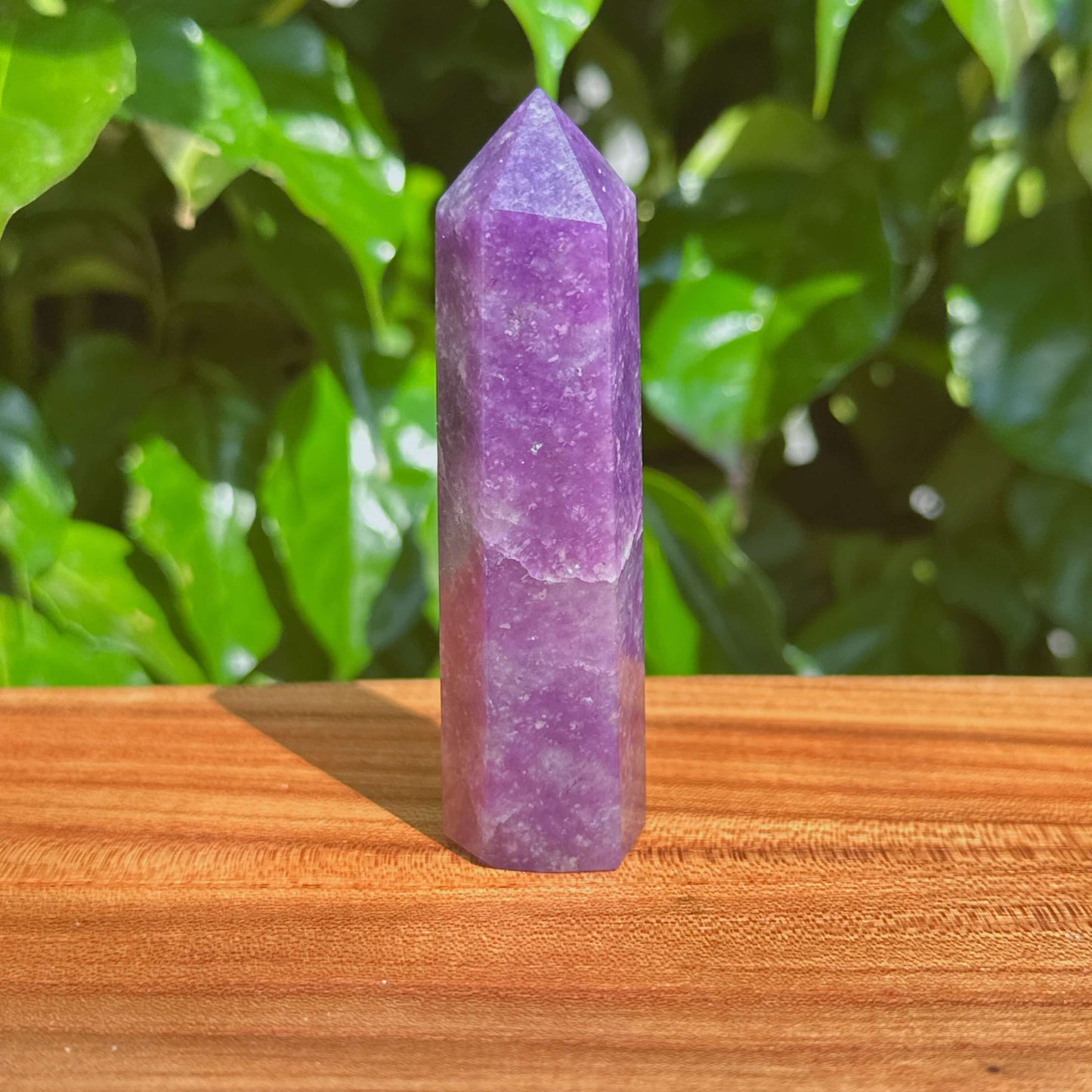 Close-up of a Lepidolite Tower displaying intricate natural textures, designed to aid in stress relief and emotional well-being.