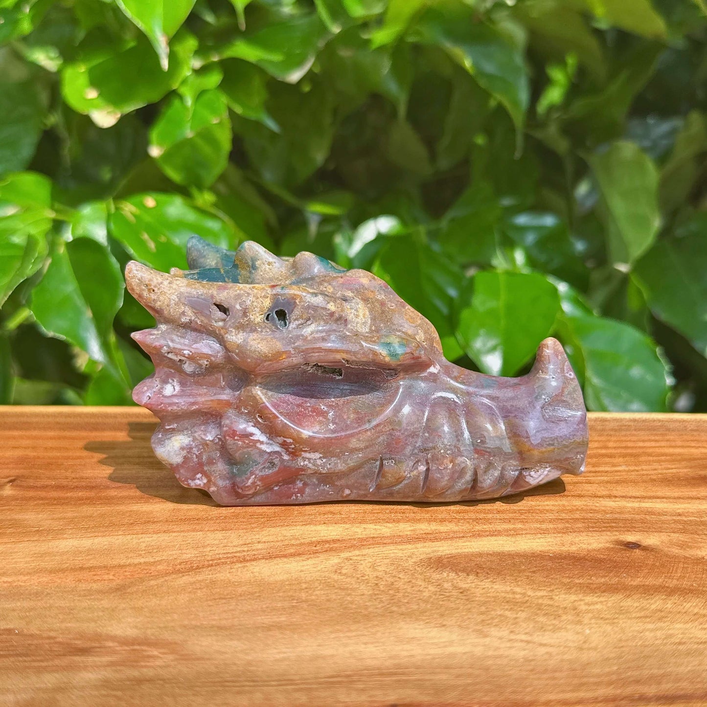 Close-up of Ocean Jasper Dragon Head Carving showcasing its fine craftsmanship and color gradient.