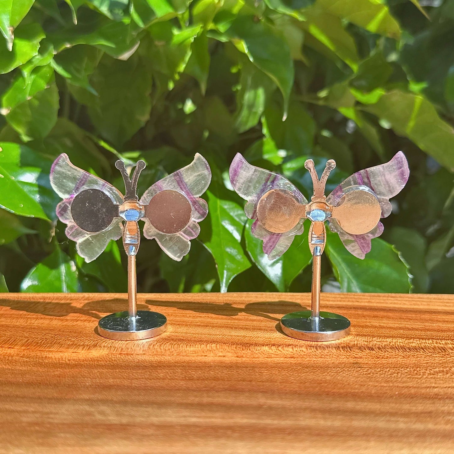 Close-up of a Rainbow Fluorite Butterfly figurine, highlighting the delicate craftsmanship and vibrant natural colors of the gemstone.