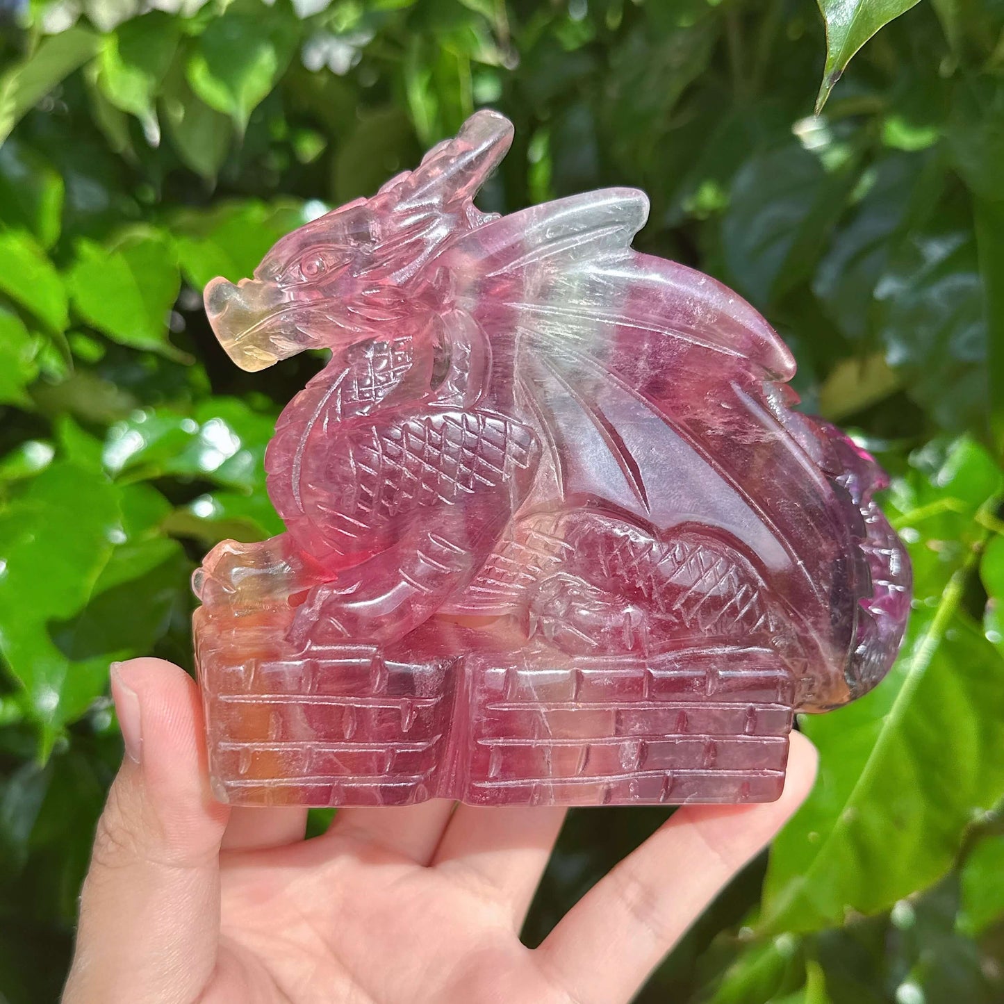 Close-up view of the Rainbow Fluorite Dragon Carving, showcasing its beautiful craftsmanship and colors.