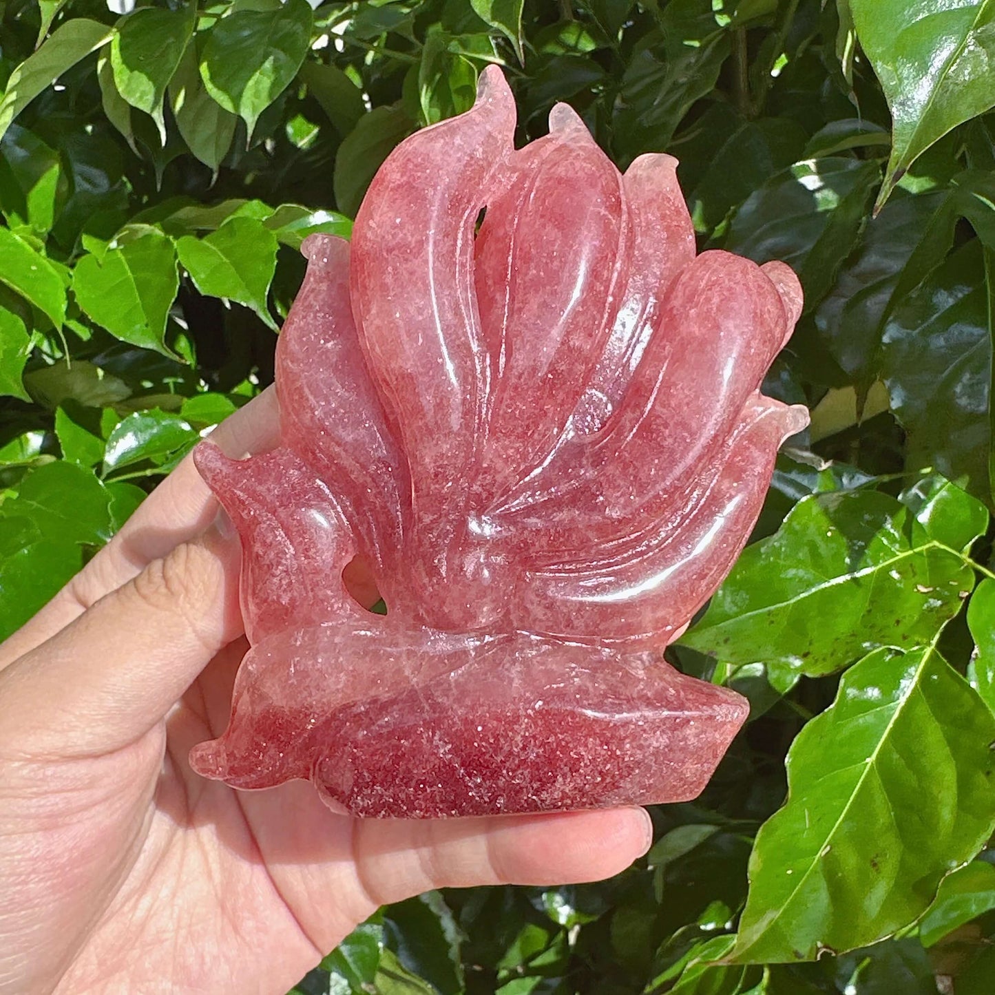 Detailed view of the Strawberry Quartz Nine-Tailed Fox Carving, showing the finely sculpted fox and tails.