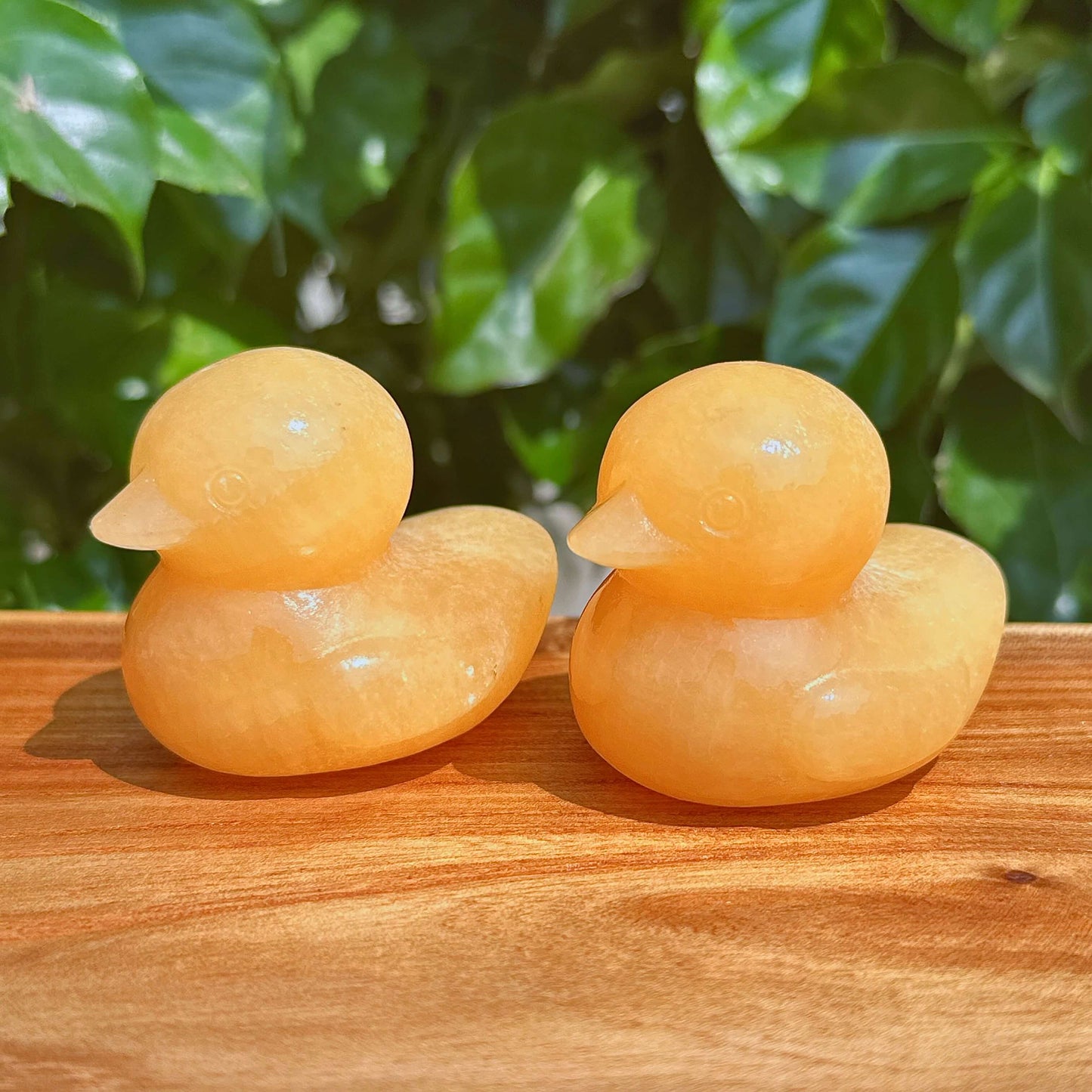 Close-up of a Yellow Calcite Duck Carving with a polished surface and distinct yellow hues.