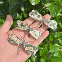 Close-up of a handcrafted ocean jasper dragonfly showcasing natural gemstone beauty.
