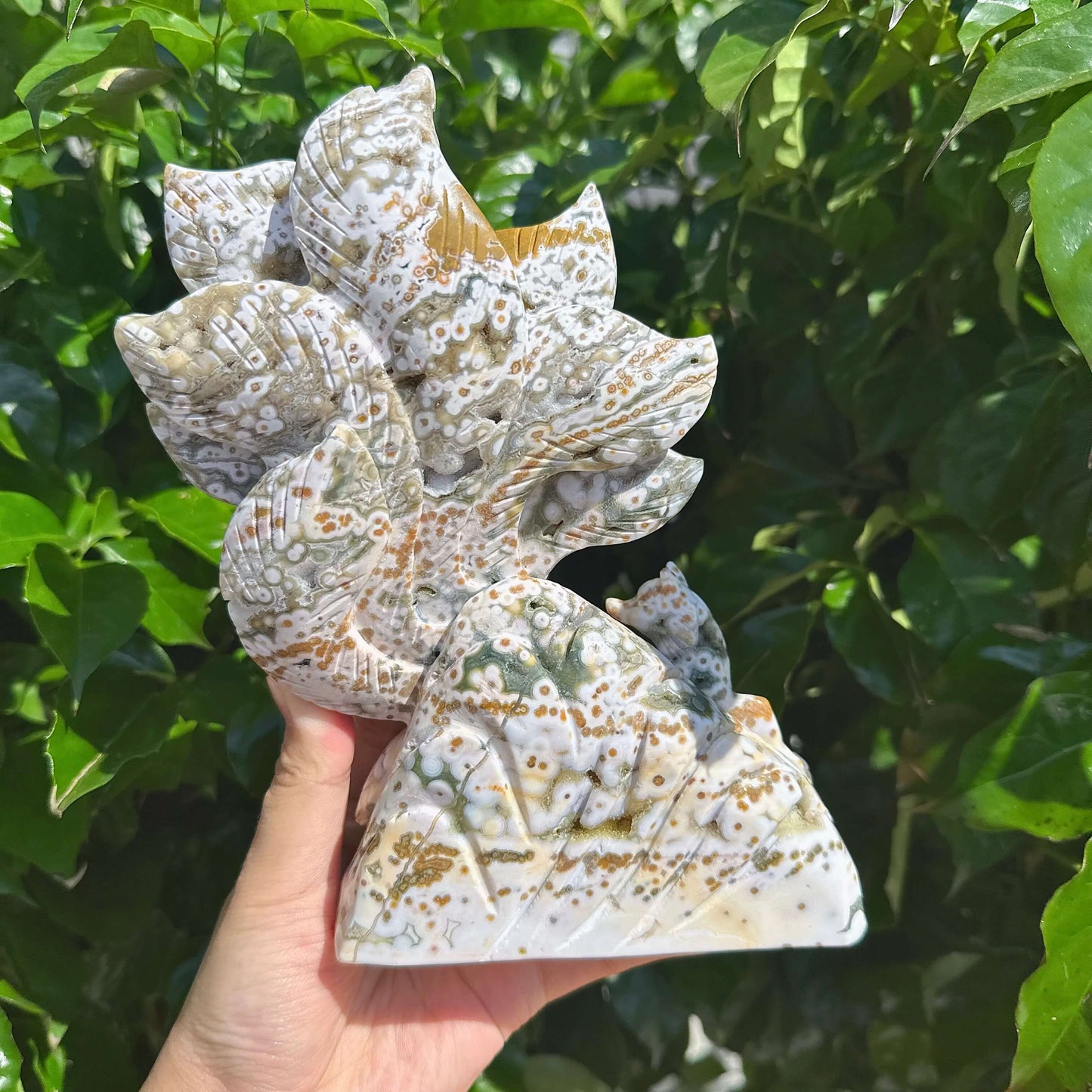 Detailed close-up of the 8th Vein Ocean Jasper Nine-Tailed Fox Carving, highlighting the intricate fox design and natural colors.