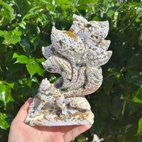 Side view of the 8th Vein Ocean Jasper Nine-Tailed Fox Carving, displaying the fine details of the fox and surrounding elements.