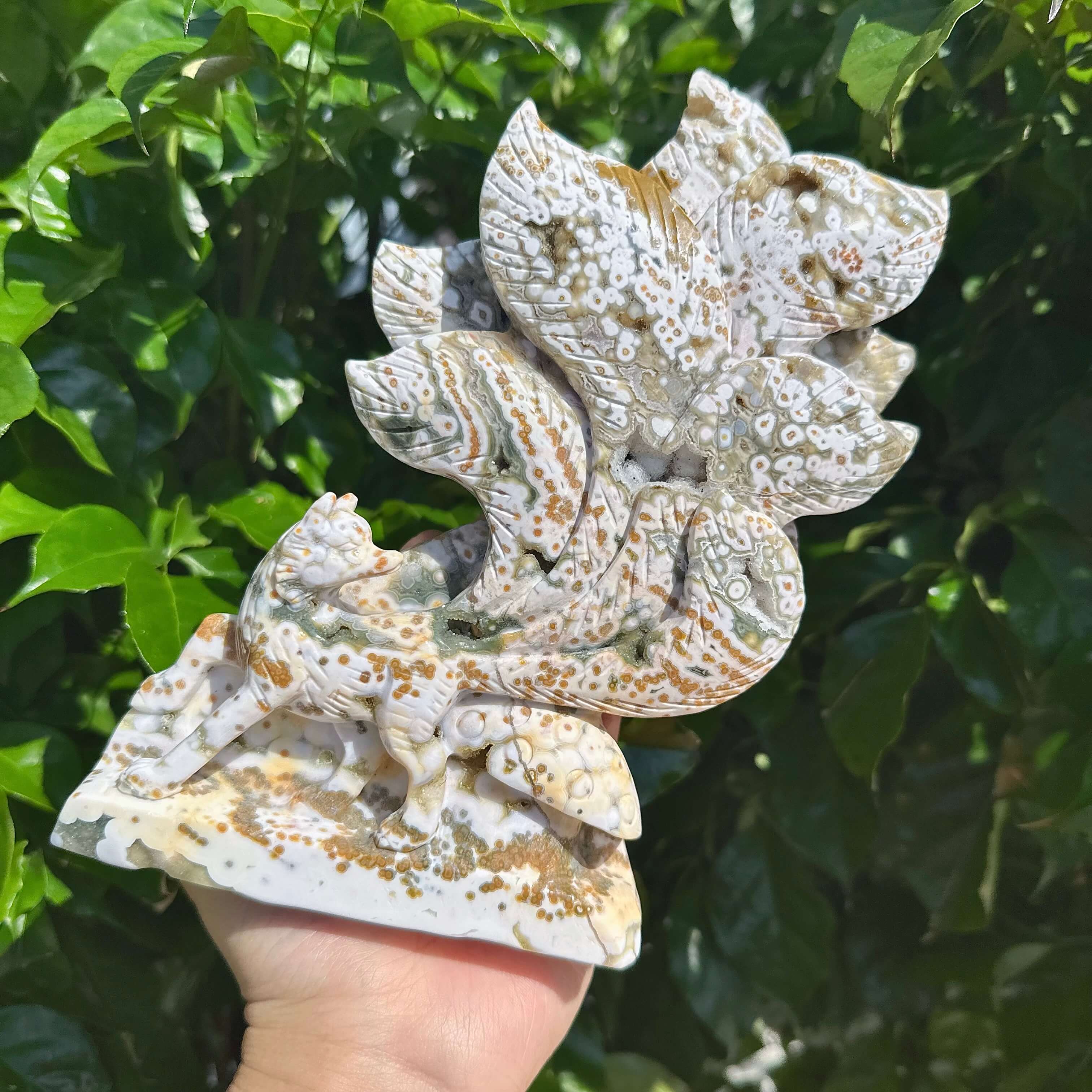 Handheld 8th Vein Ocean Jasper Nine-Tailed Fox Carving, revealing the intricate detail and natural beauty of the stone sculpture.