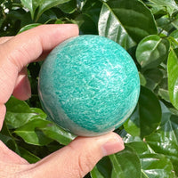 Beautiful Amazonite sphere with soft turquoise colors, perfect for energy healing and home décor.