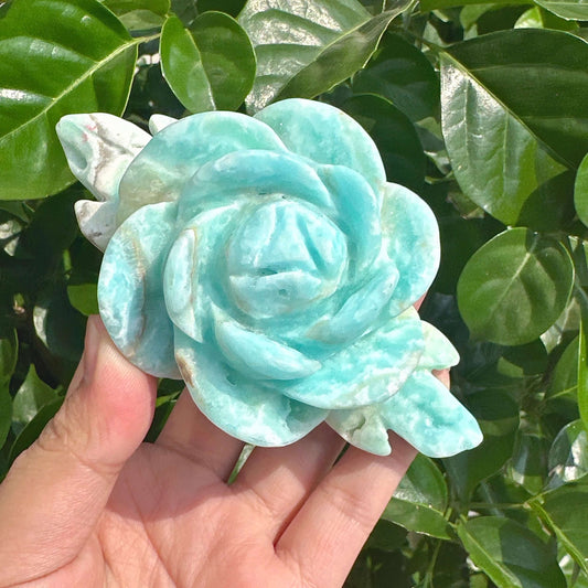 A beautiful Hemimorphite Rose Carving, with a close-up view that highlights the clarity and intricate design of the rose.