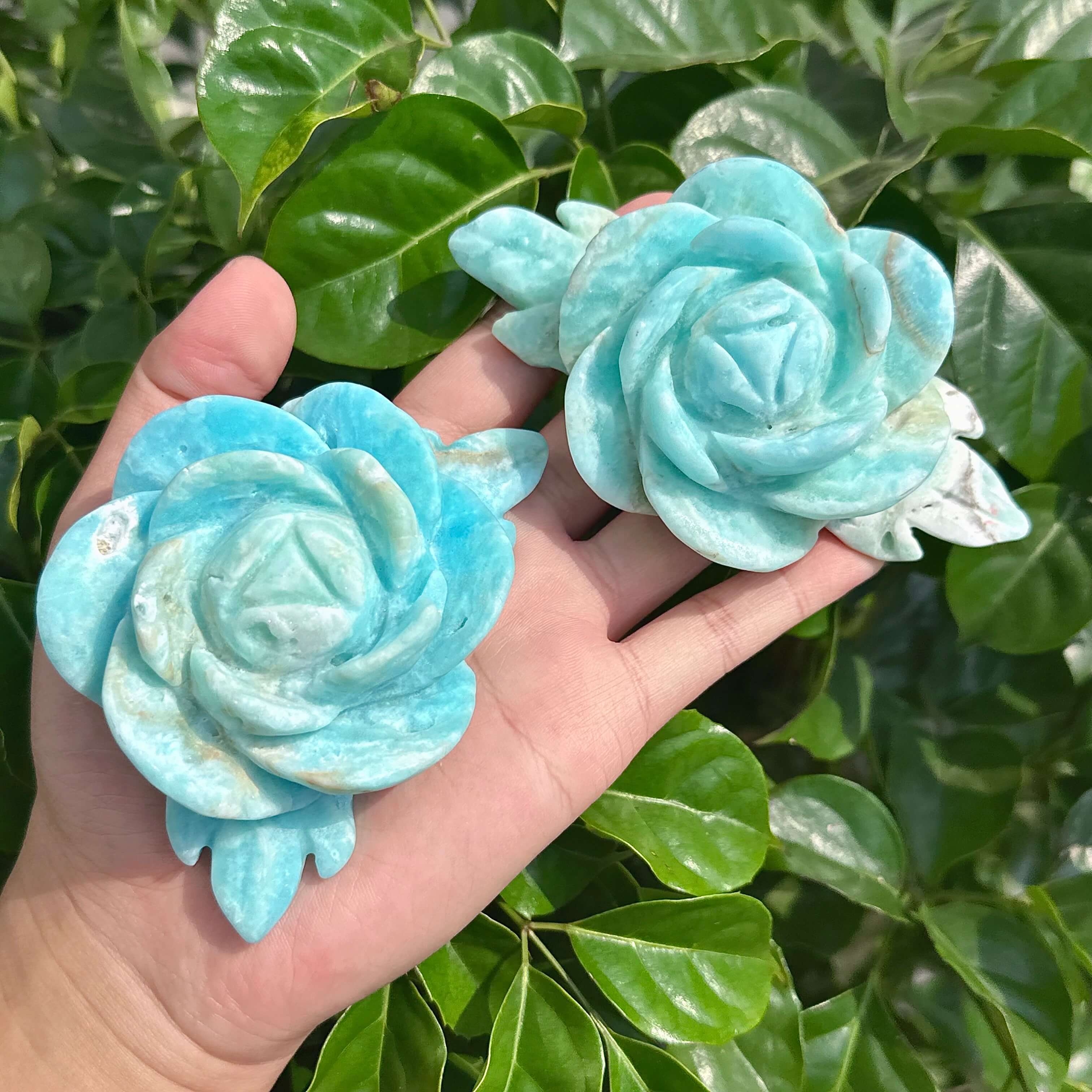 Close-up shot of a Hemimorphite Rose Carving, capturing the light reflections and the stunning craftsmanship of the piece.
