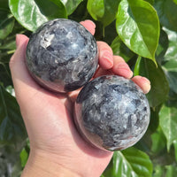 Close-up view of a Larvikite Sphere, showcasing its unique texture and natural mineral patterns, ideal for crystal enthusiasts and energy work.