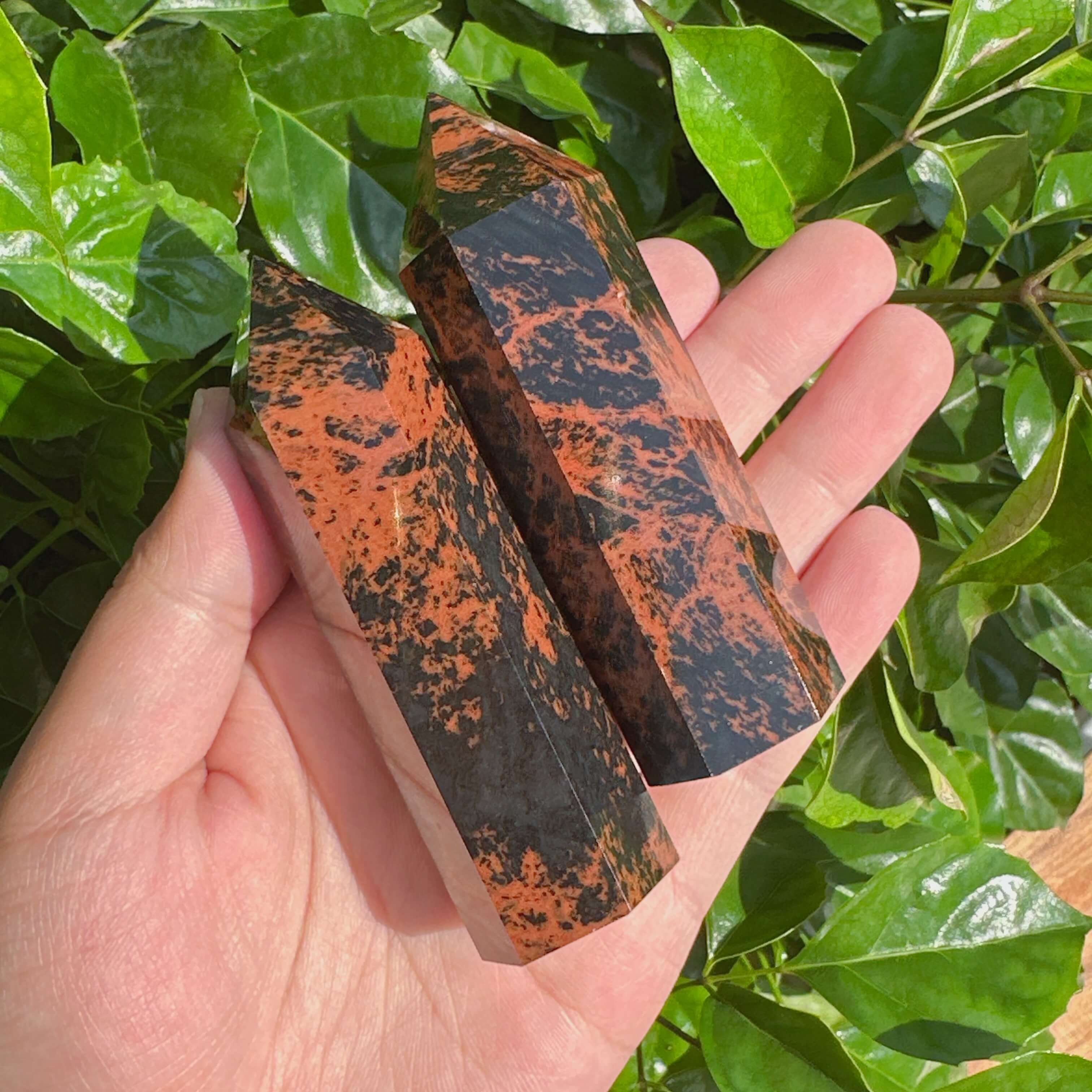 Close-up view of a Mahogany Obsidian Tower with natural color contrasts, perfect for balancing energy and decoration.
