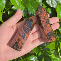 Group of Mahogany Obsidian Towers, highlighting their smooth texture and powerful energy for healing practices.