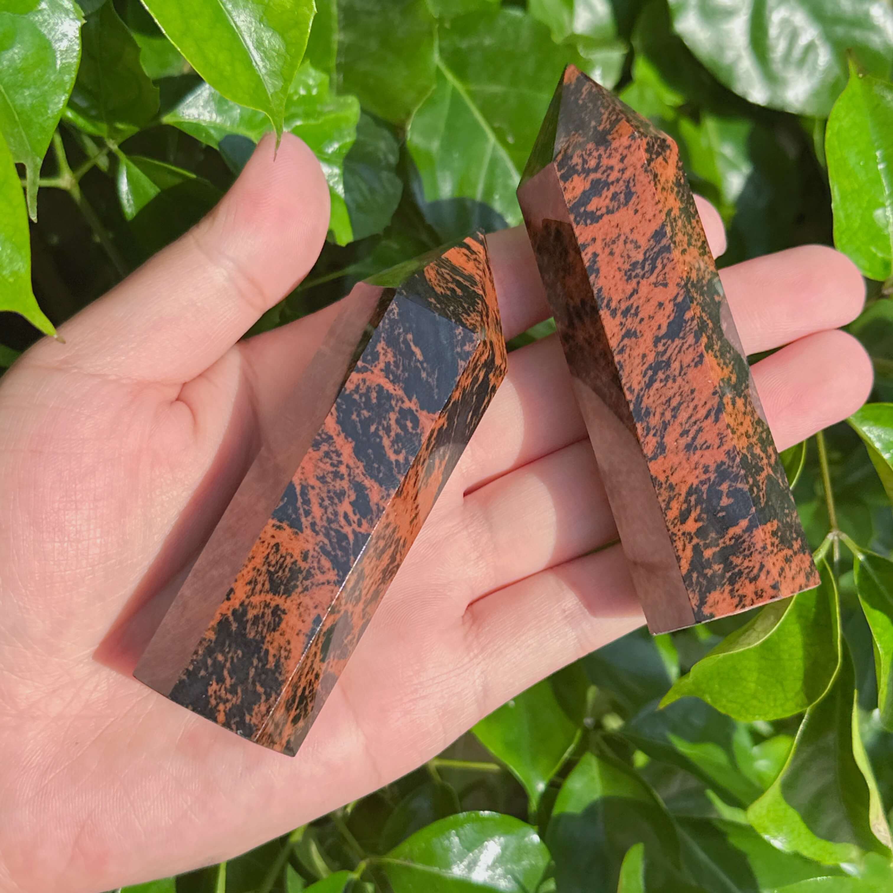 Group of Mahogany Obsidian Towers, highlighting their smooth texture and powerful energy for healing practices.
