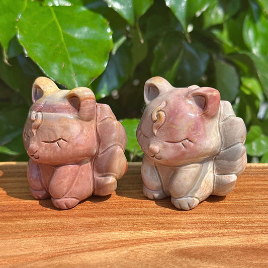 Side angle of Alashan Agate Nine-Tailed Fox Carving, displaying the fine detailing and natural patterns of the agate.