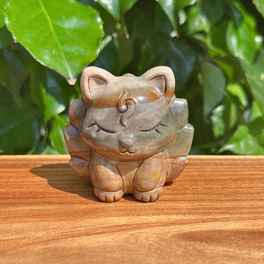 Front view of the Alashan Agate Nine-Tailed Fox carving, highlighting its smooth agate surface and delicate features.