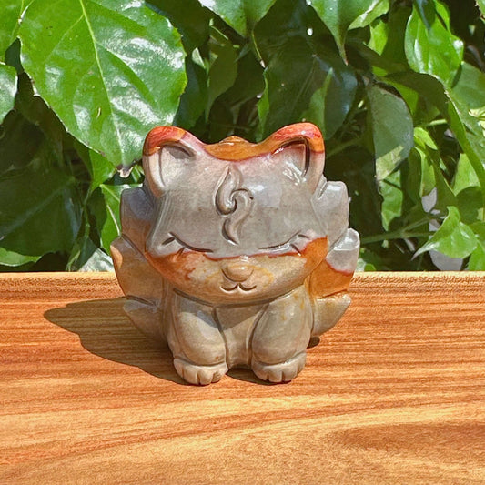 Close-up of the Alashan Agate Nine-Tailed Fox Carving, showing the vibrant agate hues and fine details.