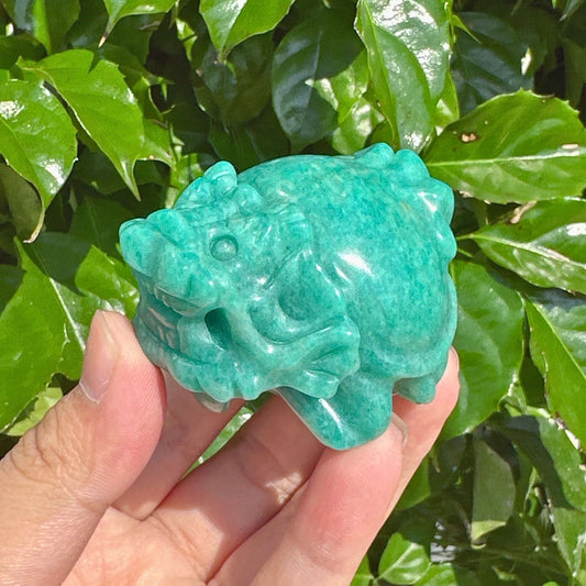 Handheld Amazonite Dragon Turtle Carving, highlighting its intricate design and color.