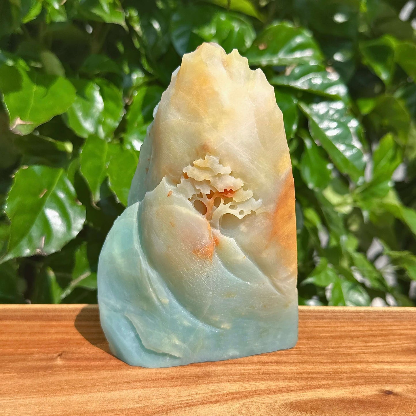 Handcrafted amazonite stone sculpture with natural flowing design, perfect for home decoration.
