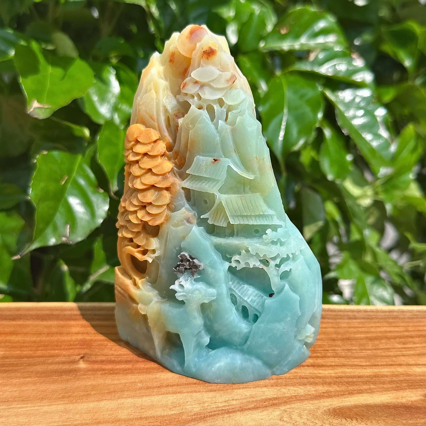 Beautiful amazonite landscape carving showcasing natural variations in color and texture for a serene look.