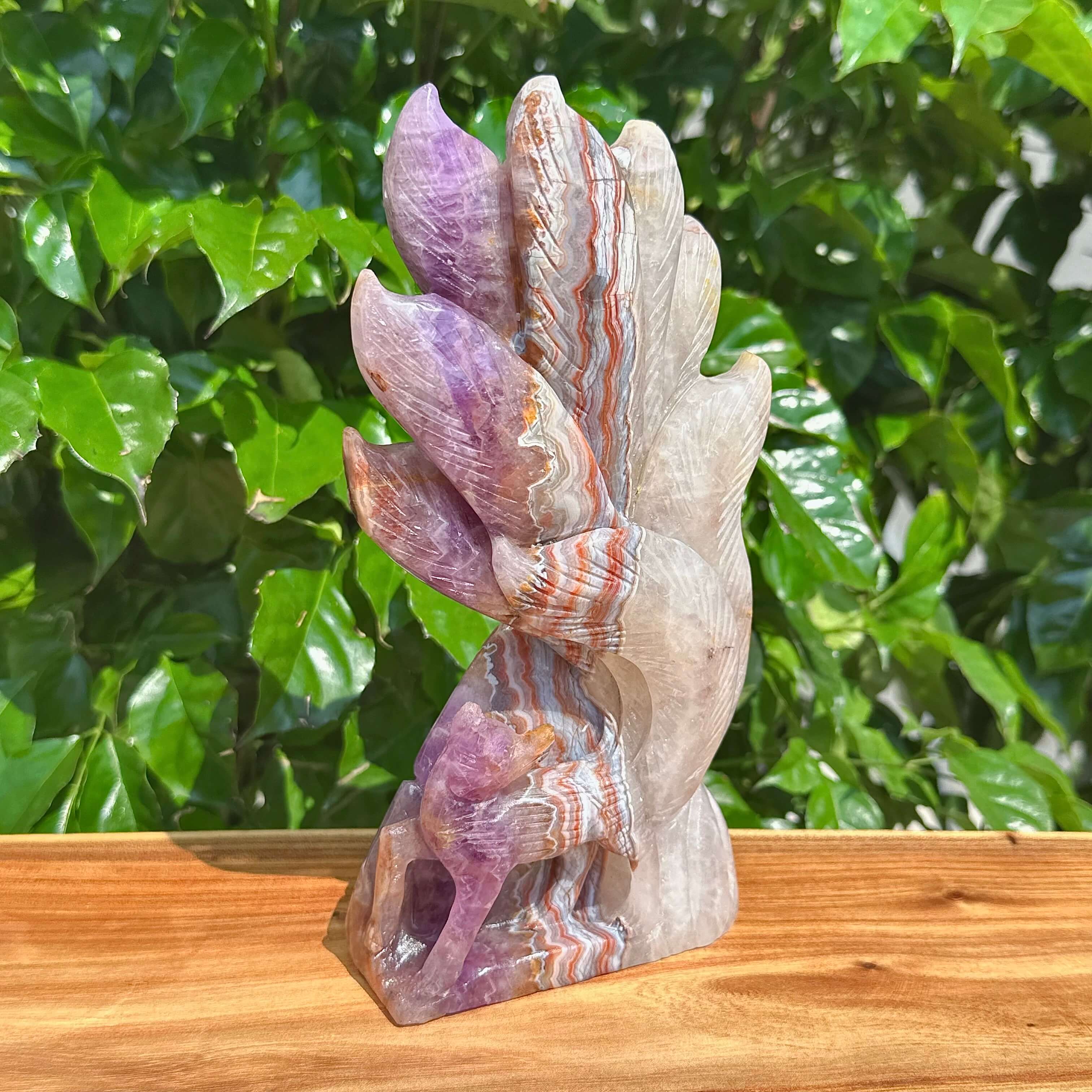Close-up of the Amethyst Agate Nine-Tailed Fox Carving, showcasing the dynamic crystal structure and intricate details.