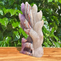 Amethyst Agate Nine-Tailed Fox Carving on display, capturing the fine craftsmanship of the sculpture.