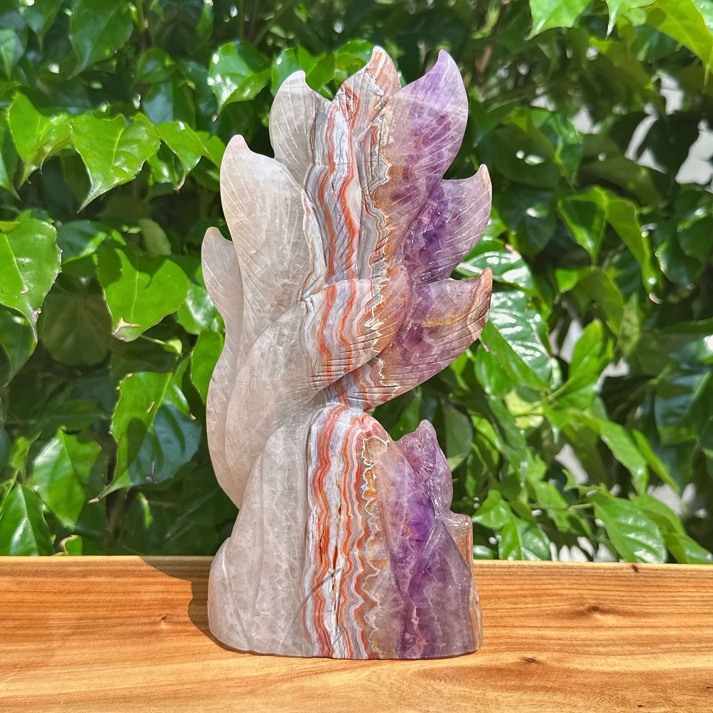 Side view of the Amethyst Agate Nine-Tailed Fox Carving, showcasing the detailed features and color blending of the crystal.