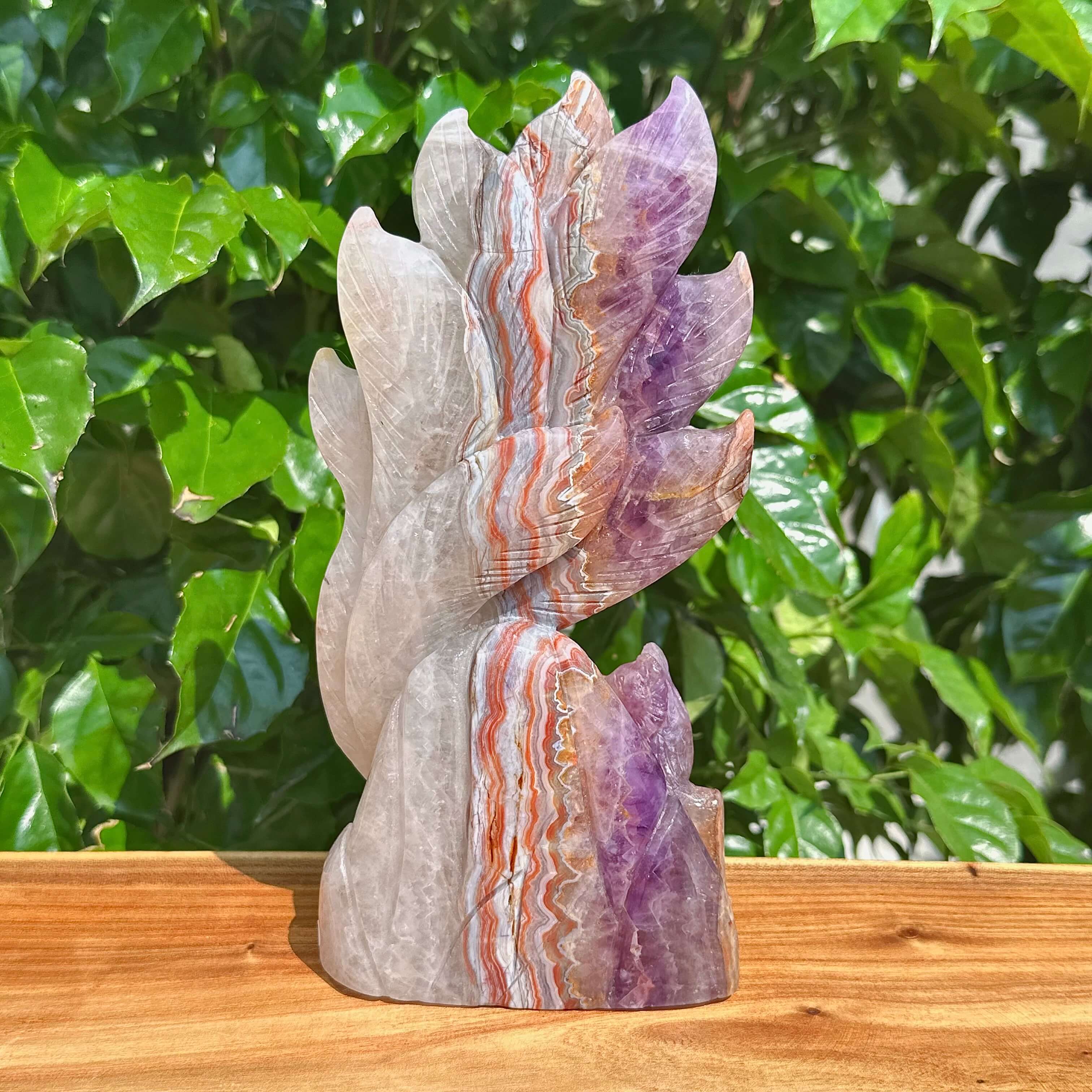 Side view of the Amethyst Agate Nine-Tailed Fox Carving, showcasing the detailed features and color blending of the crystal.