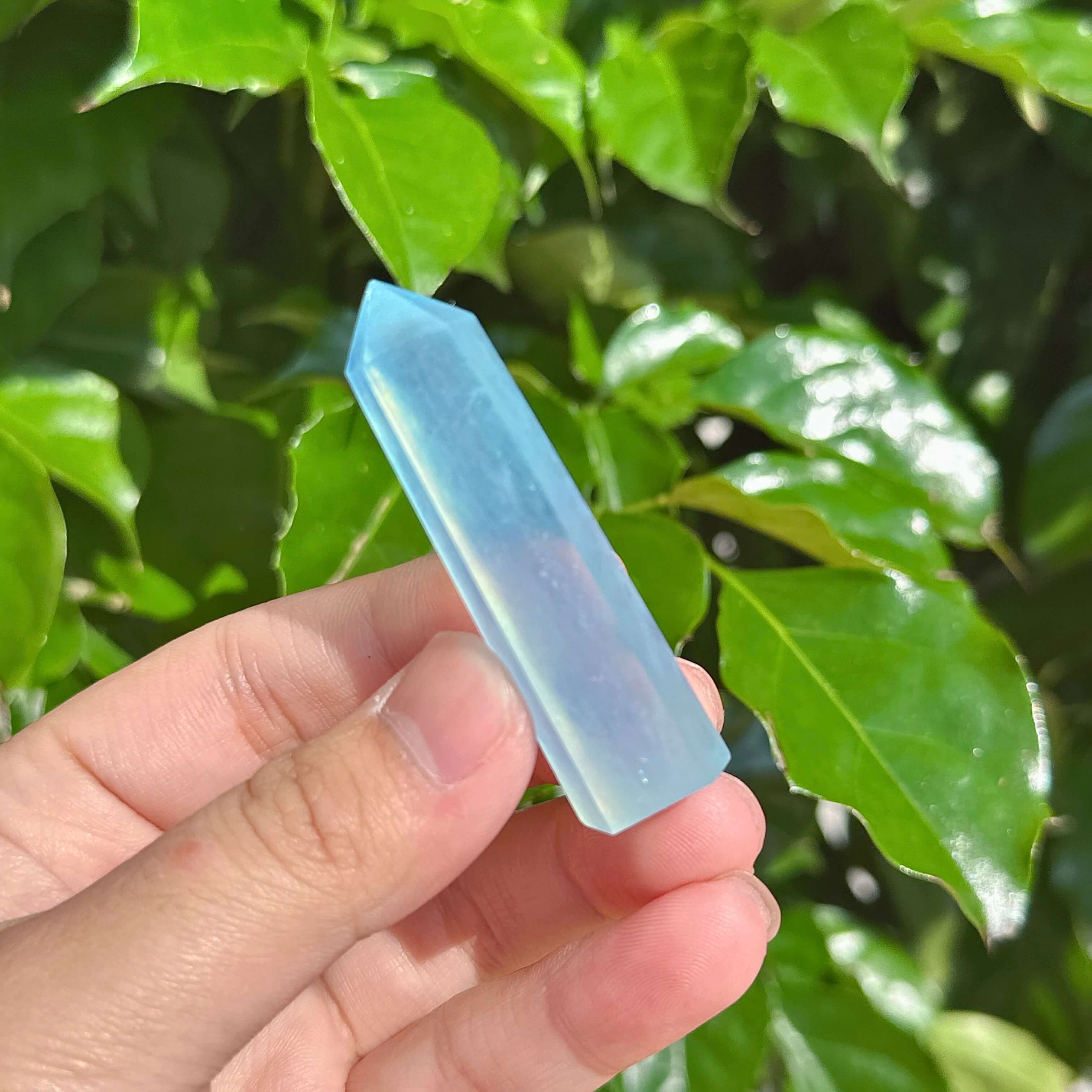 A collection of beautiful Aquamarine crystal towers with transparent blue shades, reflecting light.