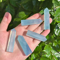 Single Aquamarine tower with delicate blue tones, perfect for crystal healing and energy balancing.
