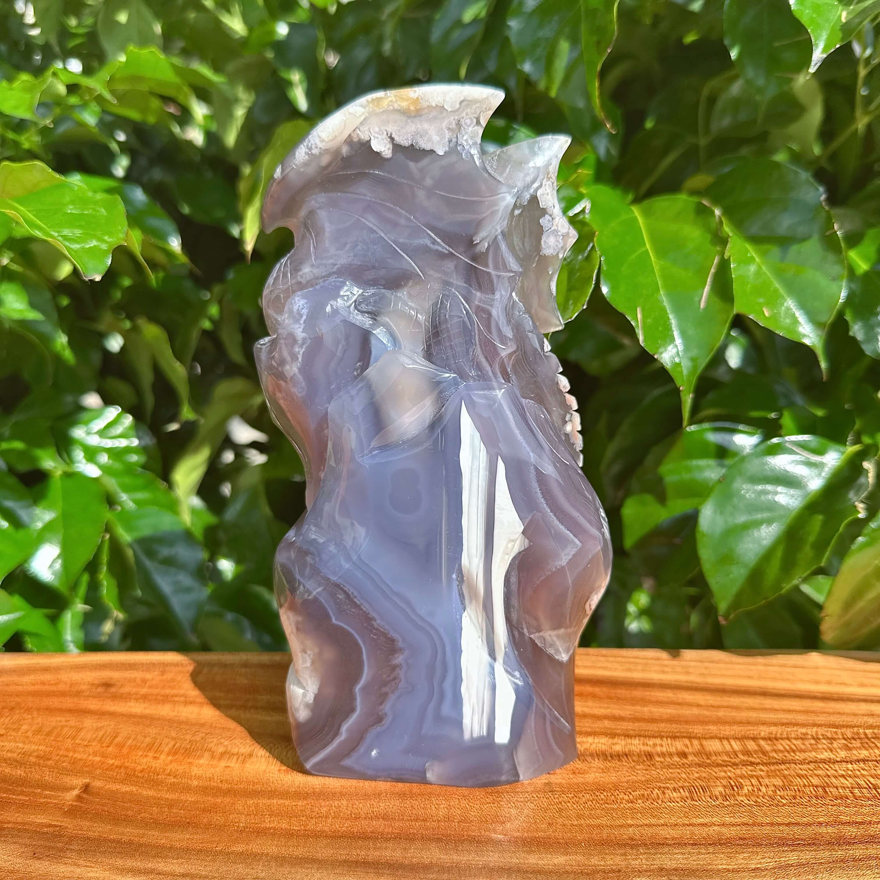 Black Flower Agate Dragon Sculpture - Side view showcasing the intricate dragon wings and textures
