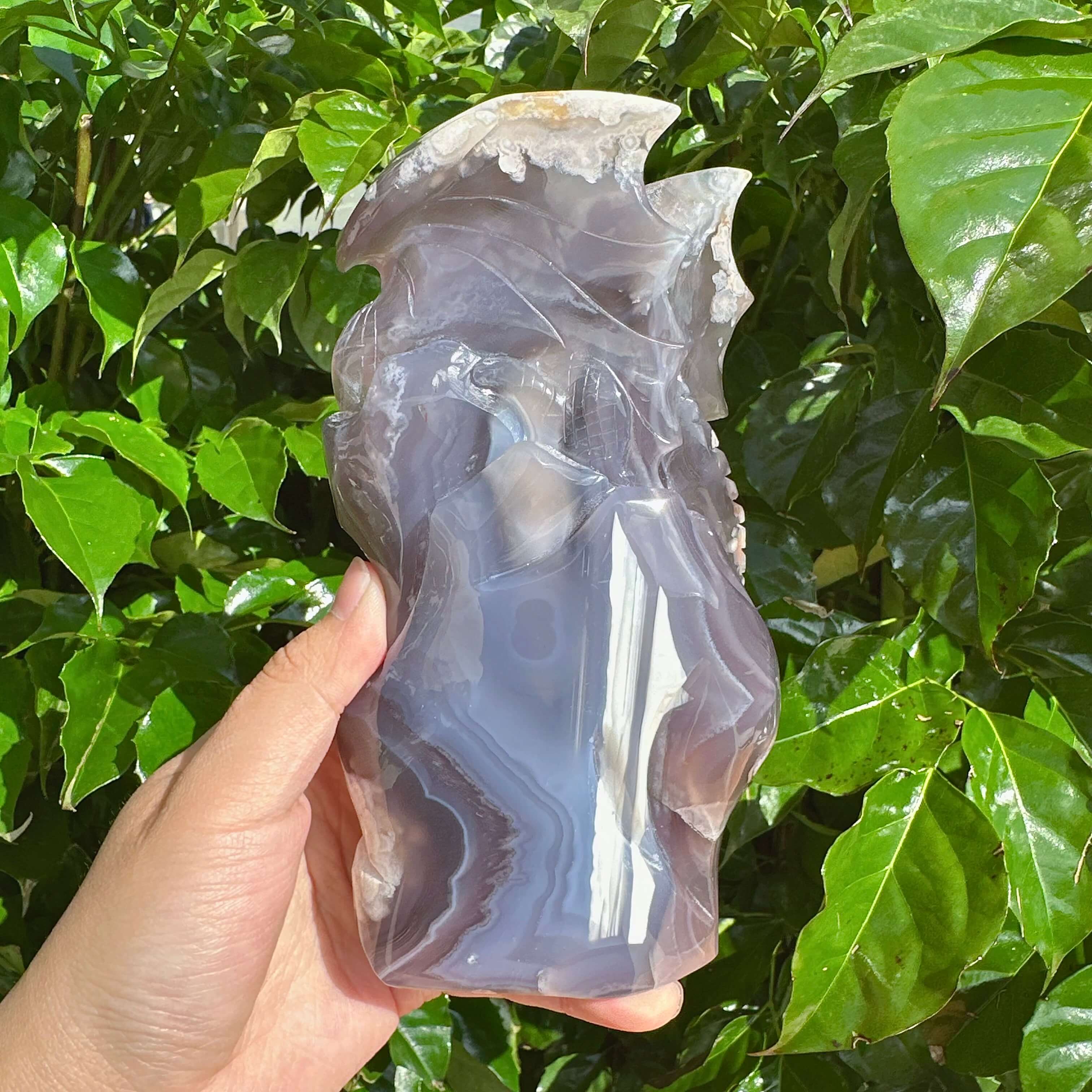 Handcrafted Black Flower Agate Dragon Carving - A powerful depiction of a dragon perched on a base with unique agate patterns