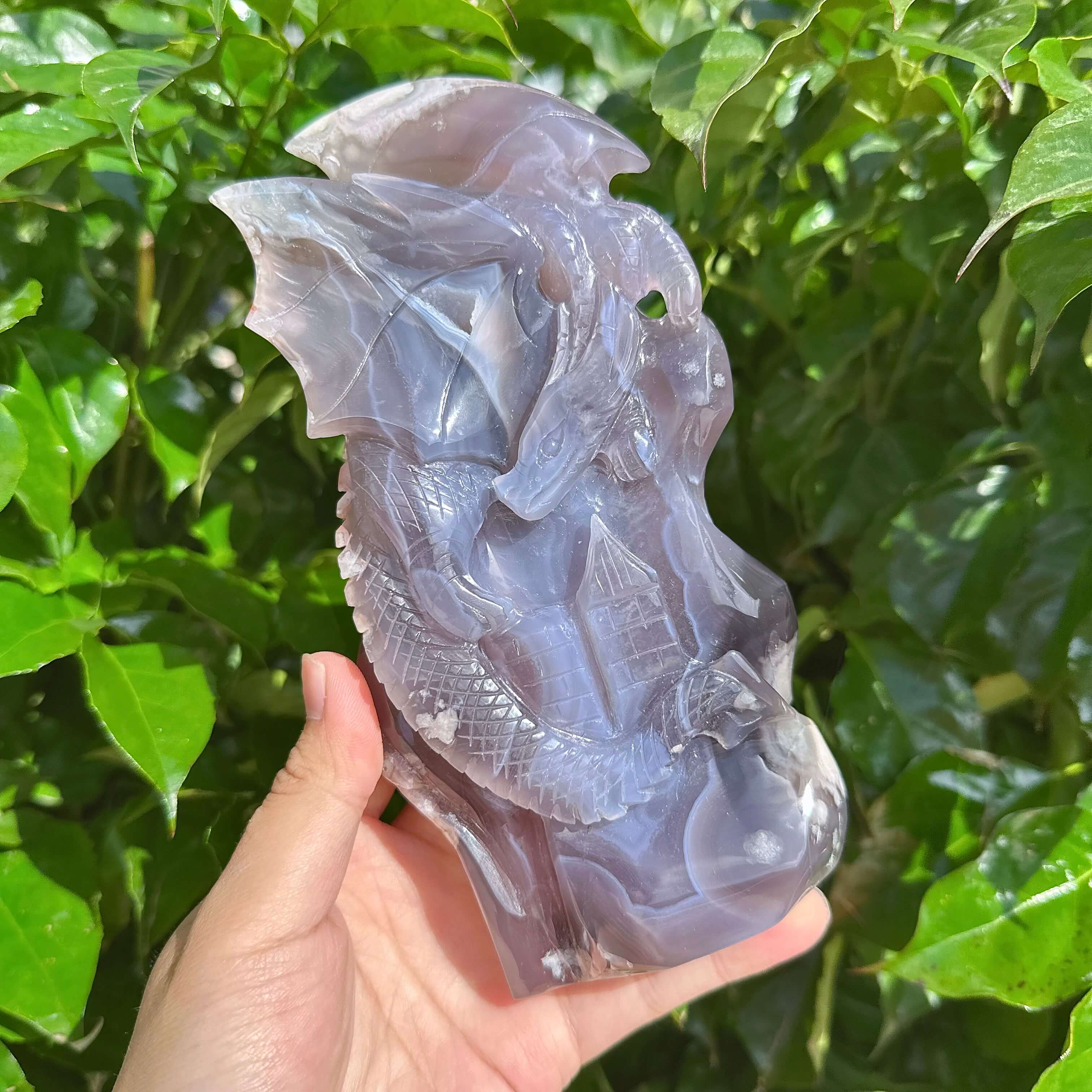 Black Flower Agate Dragon Sculpture - Front view of the dragon carving with fine details and color contrast.