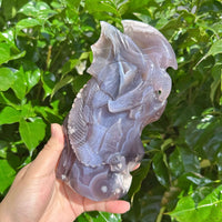Black Flower Agate Dragon Carving - Detailed view of the dragon sculpture with sharp features and natural agate formations