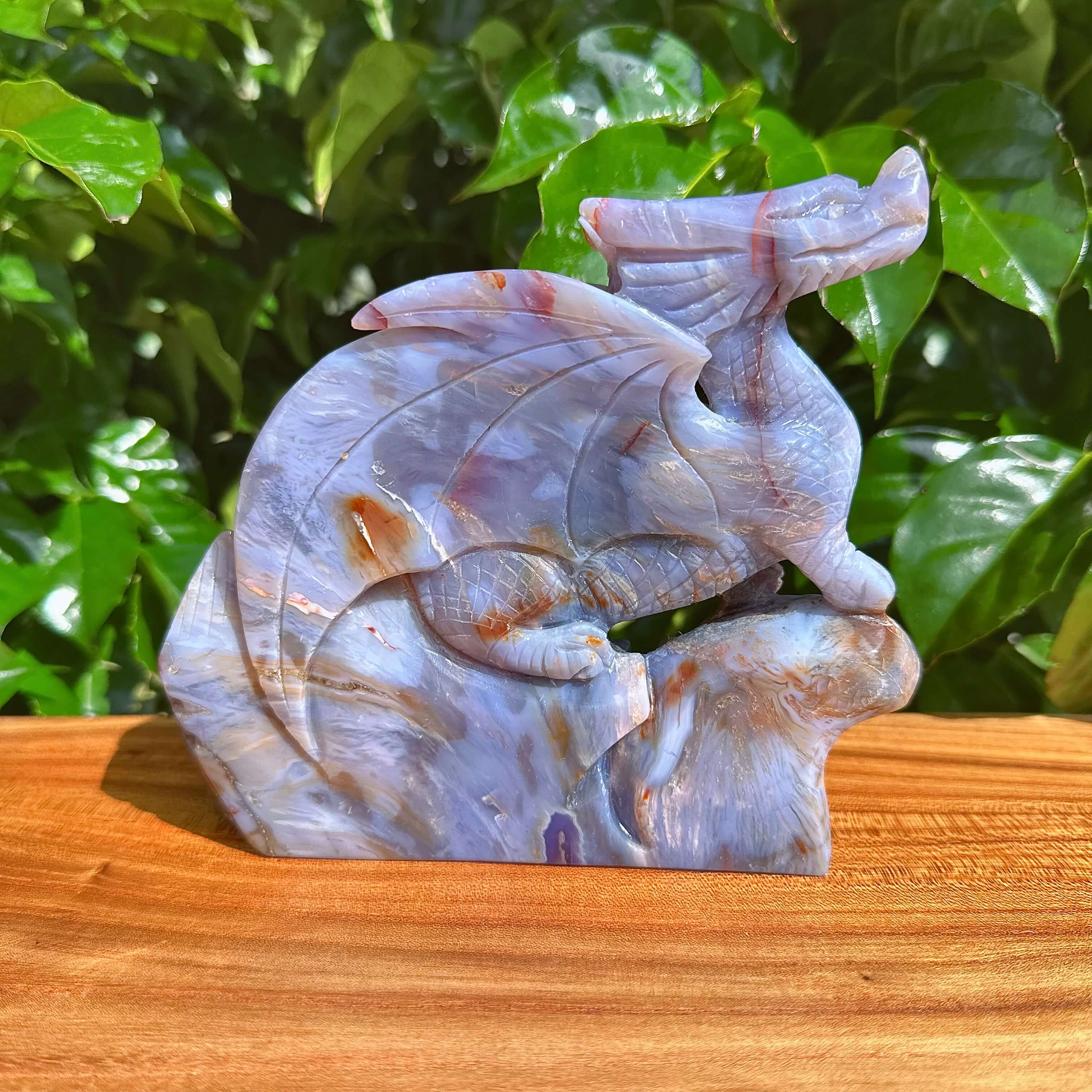 Back view of Blue Flower Agate Dragon Carving highlighting the base and dragon’s tail.