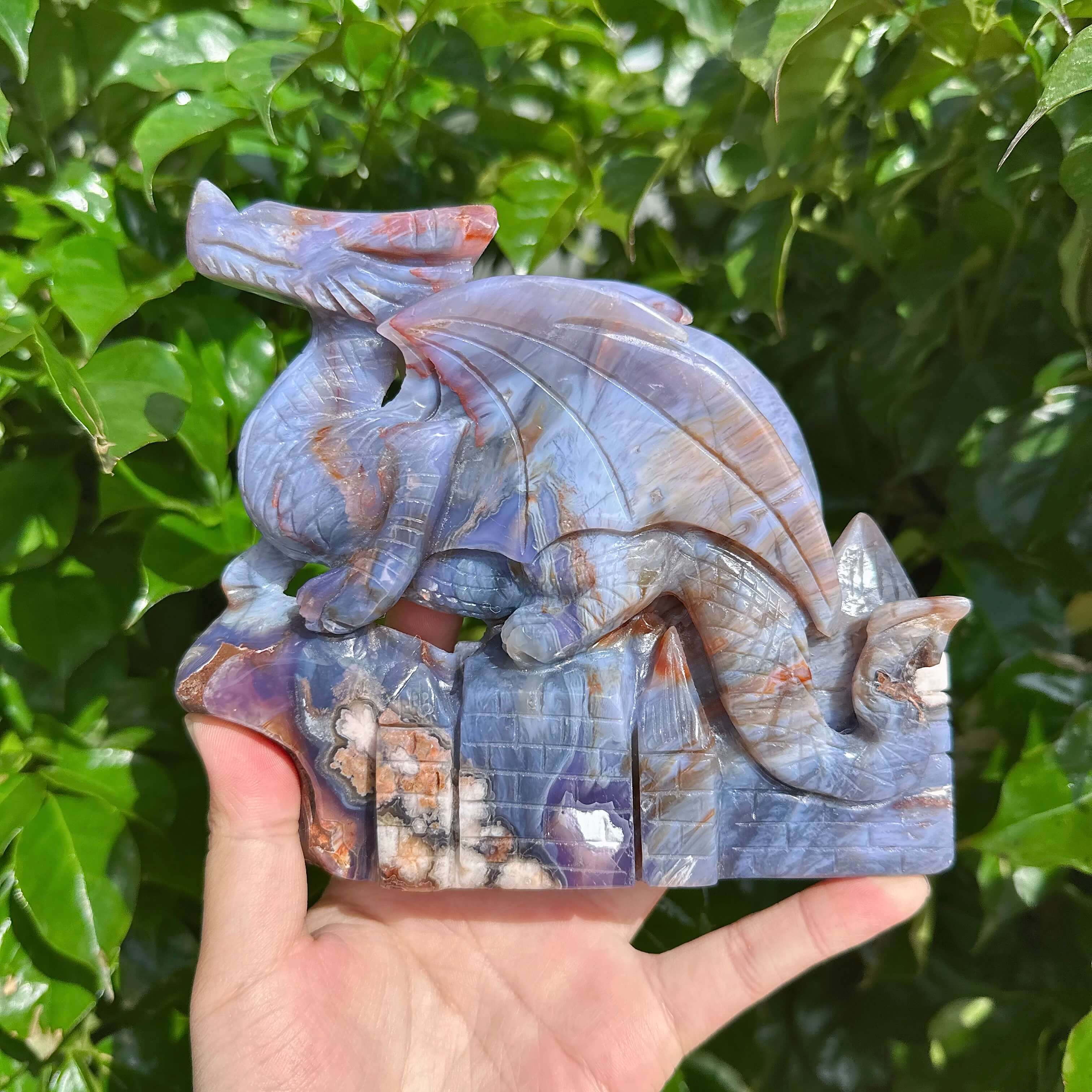 Close-up of the Blue Flower Agate Dragon Carving showing intricate details and textures.