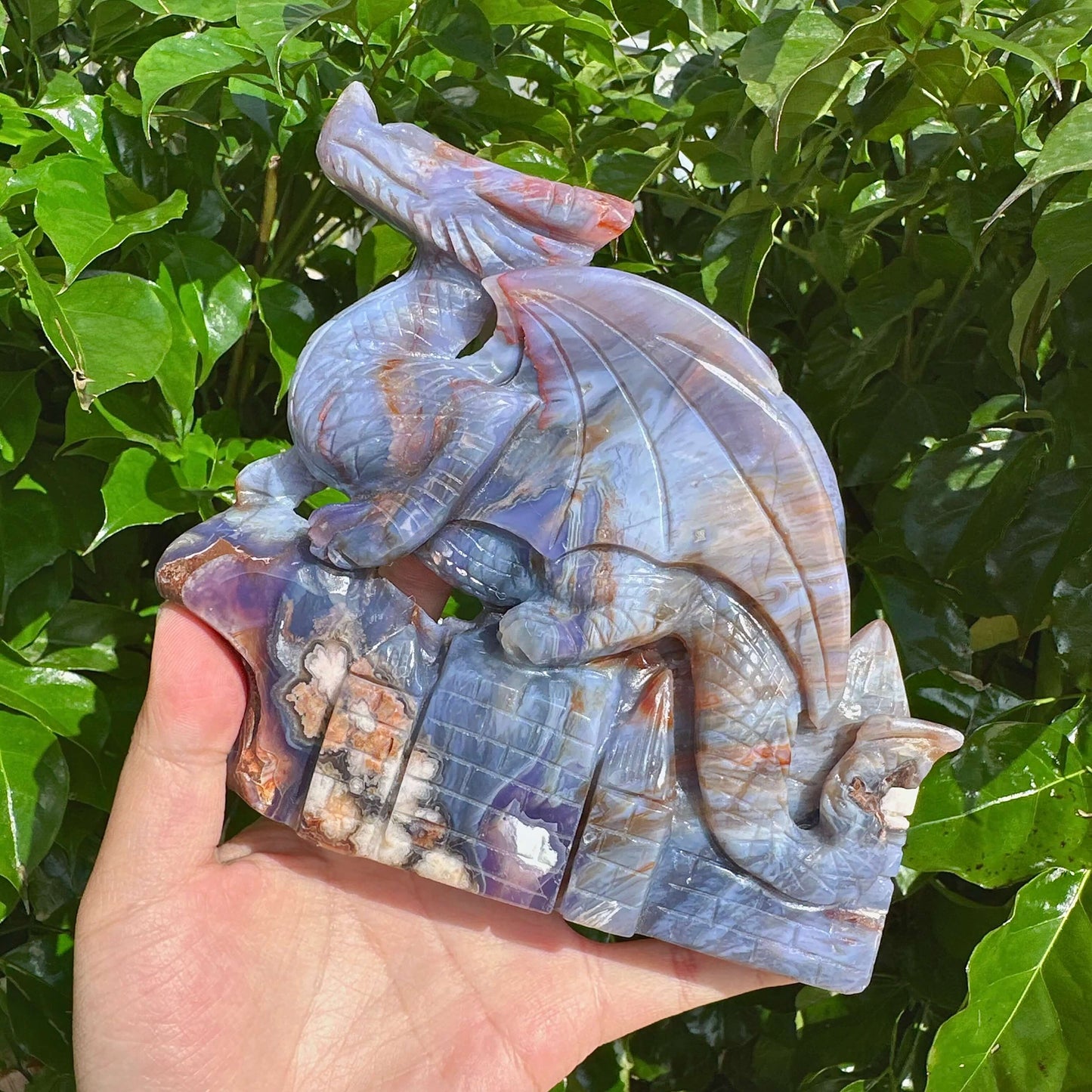 Side view of Blue Flower Agate Dragon Carving showcasing the sculpted wings and dragon features.