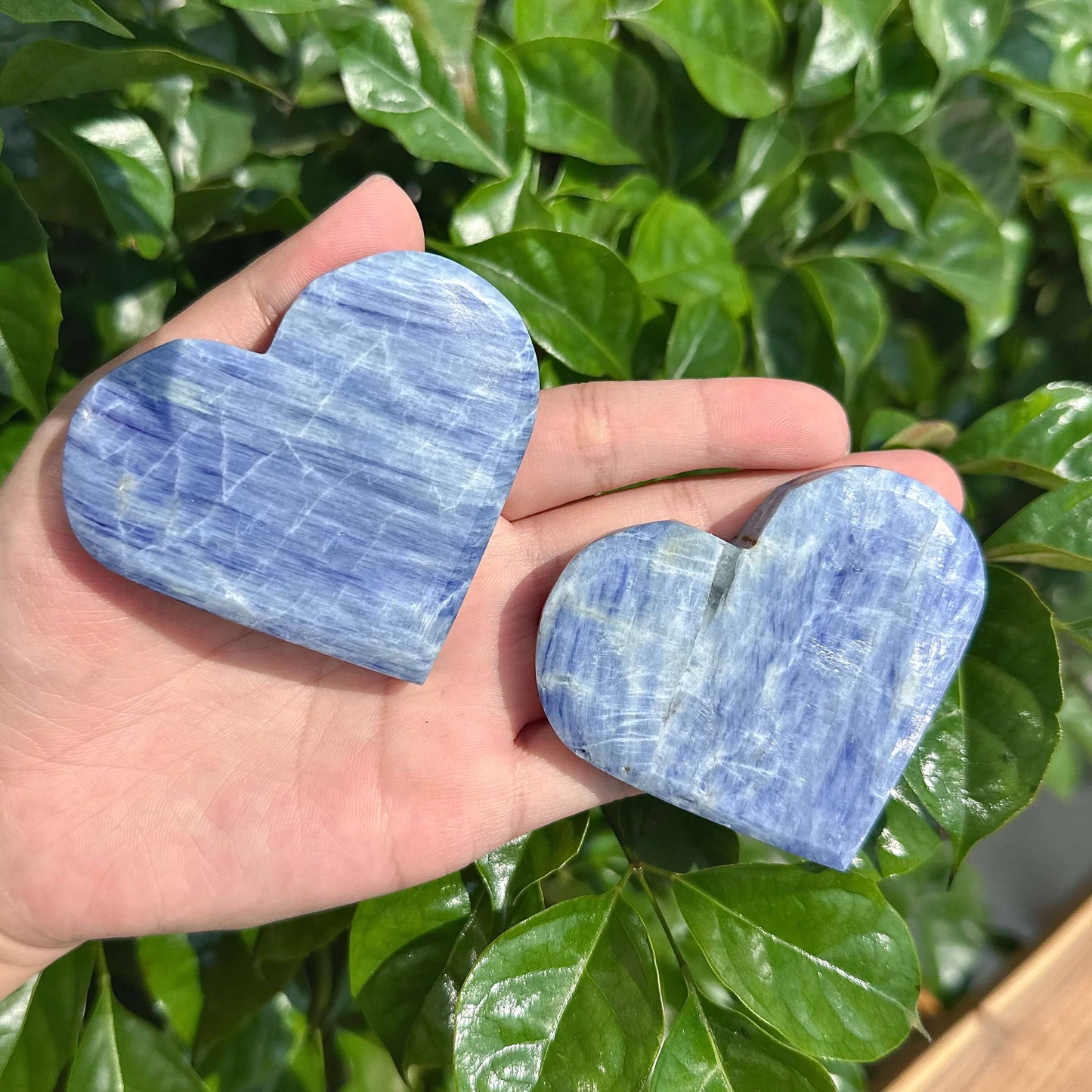 Close-up of a Blue Kyanite Heart crystal, emphasizing its natural colors and smooth texture.