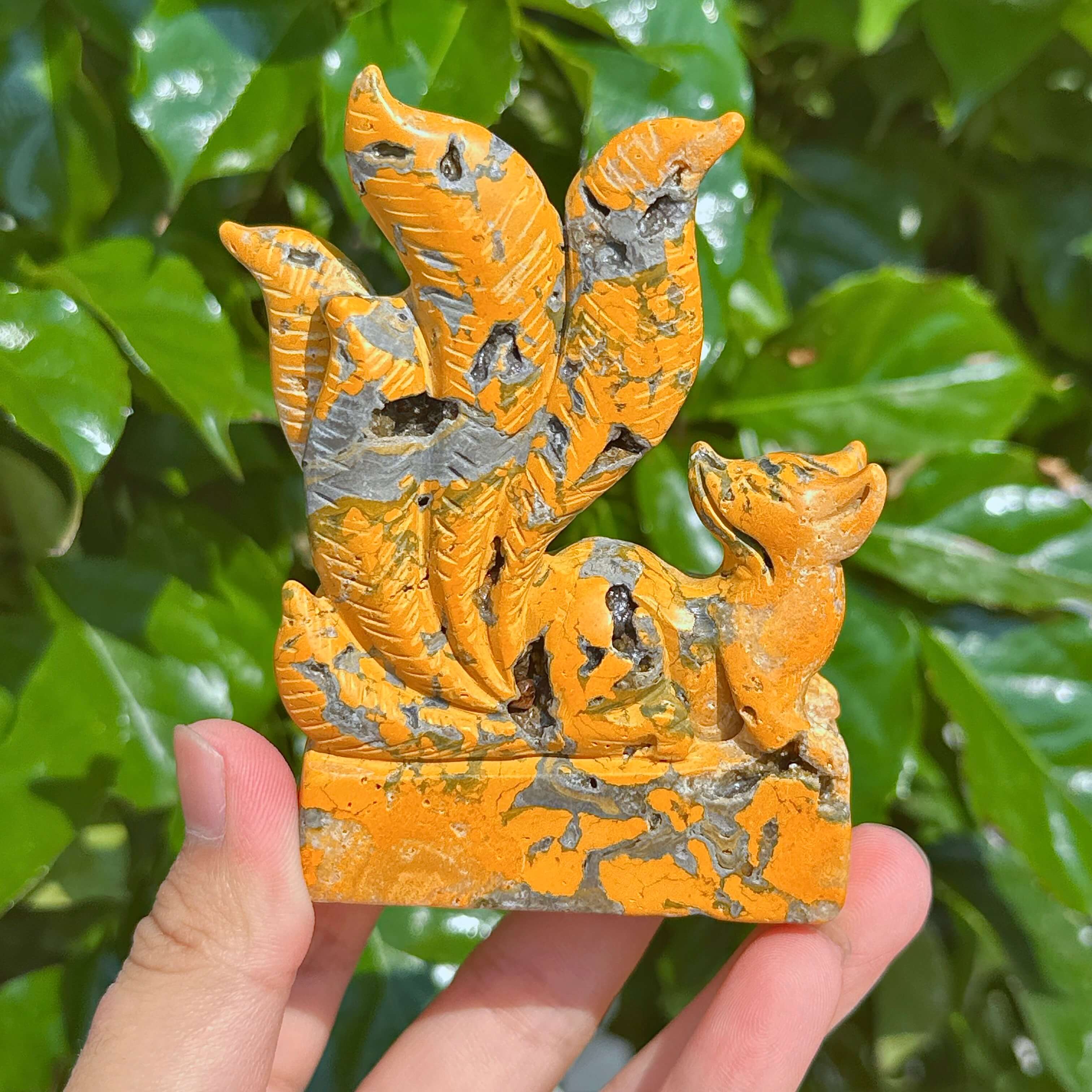 Close-up of Bumble Bee Jasper Nine-Tailed Fox Carving, featuring its dynamic design and natural stone texture.