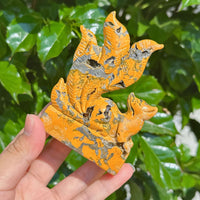 Side view of Bumble Bee Jasper Nine-Tailed Fox Carving, emphasizing the detailed carving of the nine tails and fox figure.