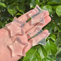 Clear Quartz Star Carving, transparent and polished crystal star with a natural glow