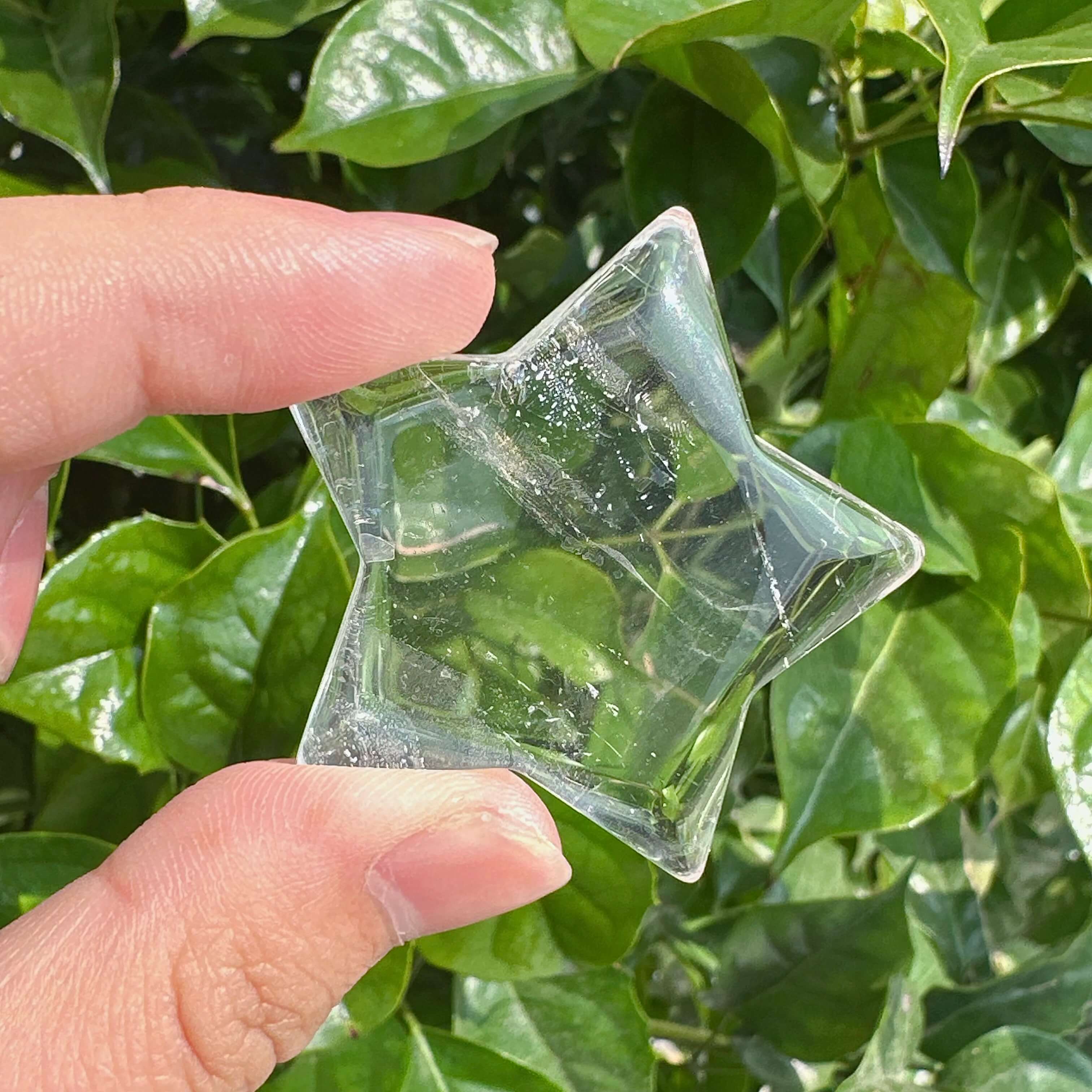 Clear Quartz Star Carving with smooth edges, perfect for home decor