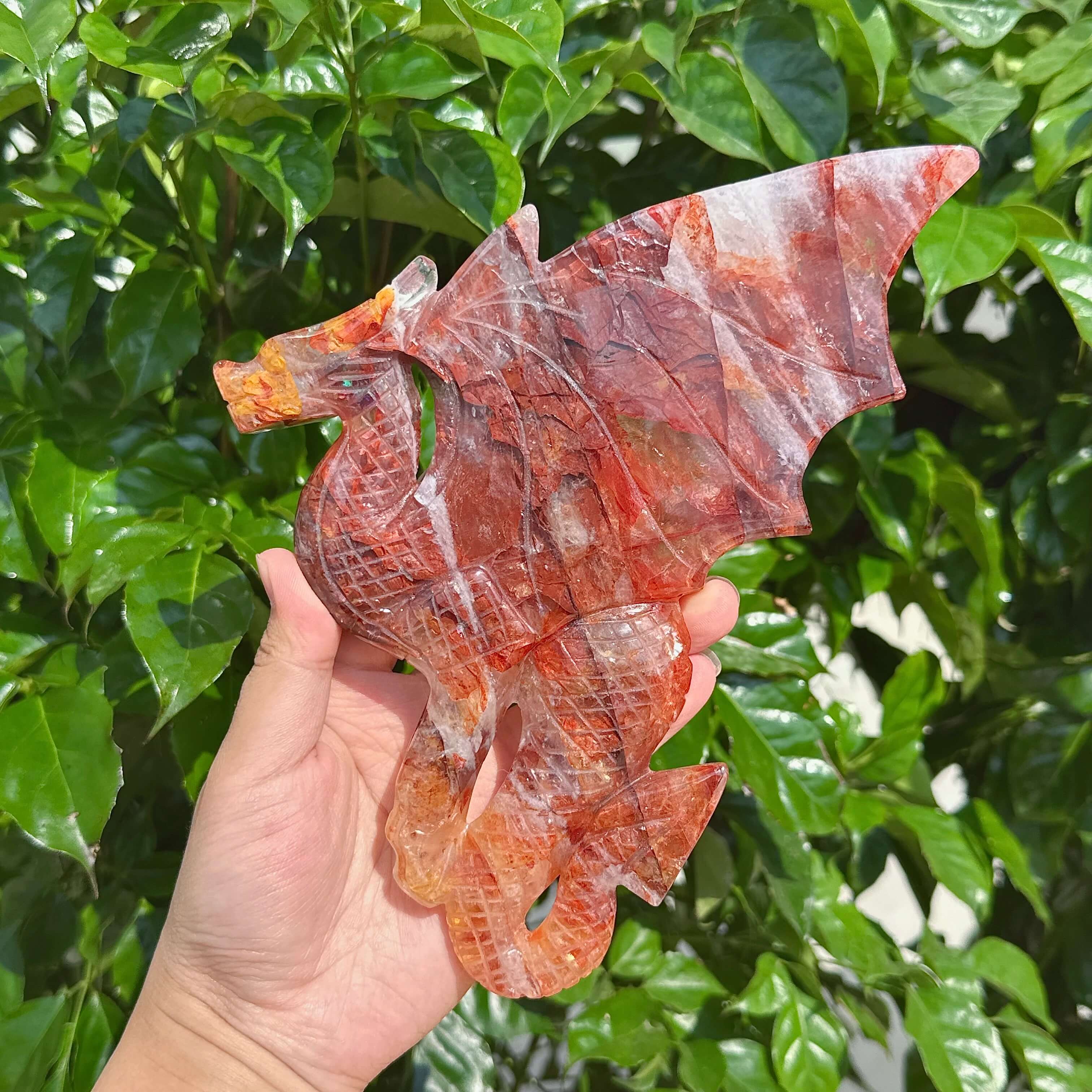 Fire Quartz Dragon Carving displayed in full view, highlighting the intricate features and unique textures of the crystal.